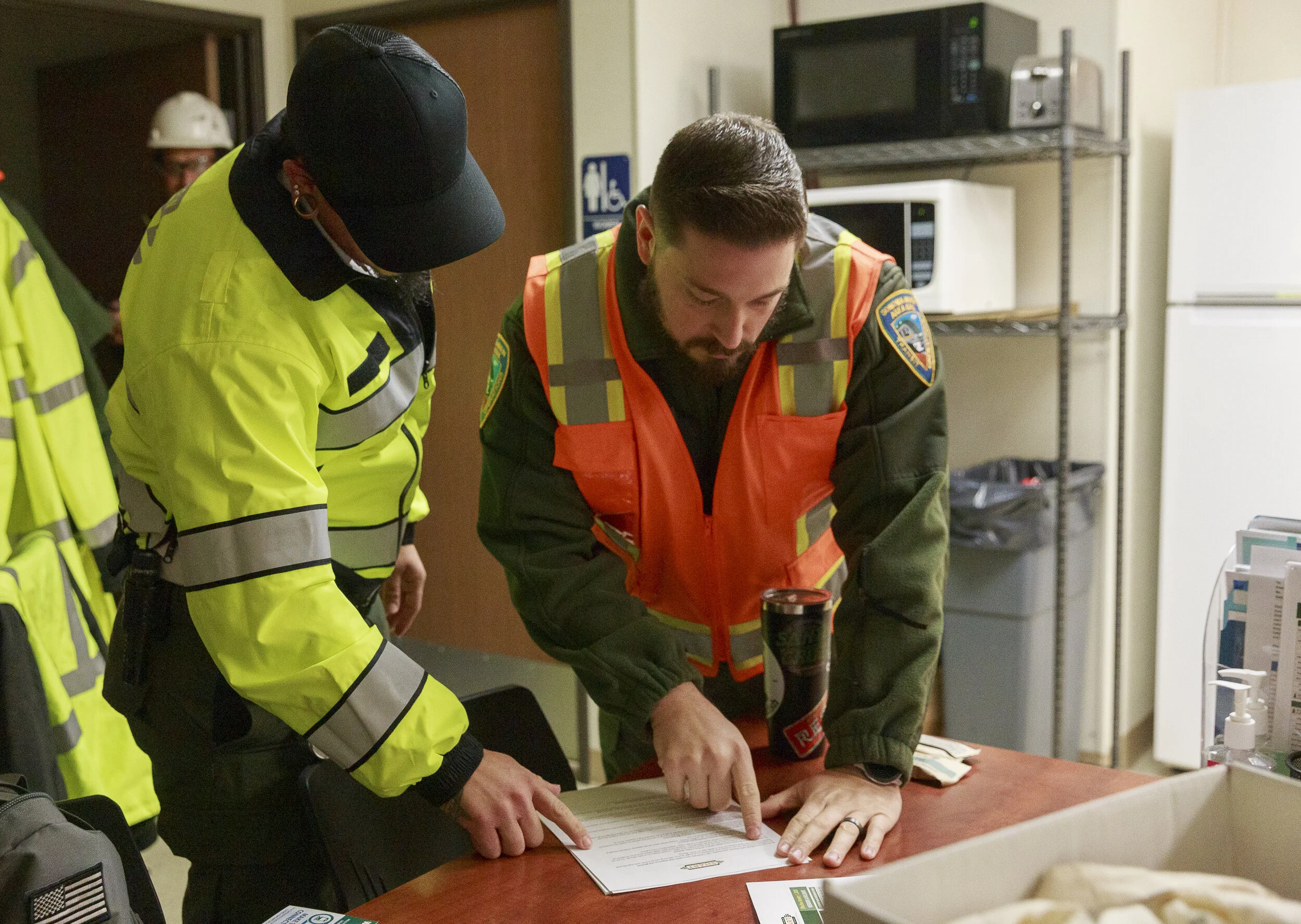 Joseph Torrigino-Baca (left) and Ryan Aranda (right) read through paperwork in preparation for the work day on Jan. 5, 2020, in Santa Rosa, CA. (Photo: Genesis Botello)