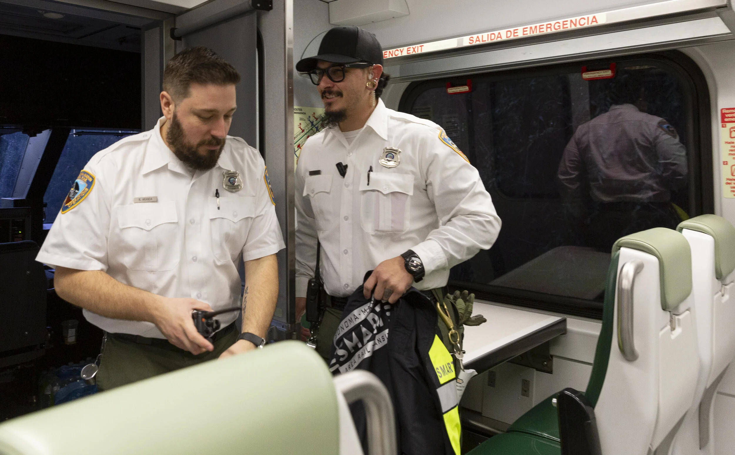 Ryan Aranda (left) exiting the right cab and walking towards the left cab to move the train forward into Santa Rosa Airport station, Joseph Torrigino-Baca (right) training and observing Ryan on Jan. 5, 2020, in Santa Rosa, CA. (Photo: Genesis Botell…