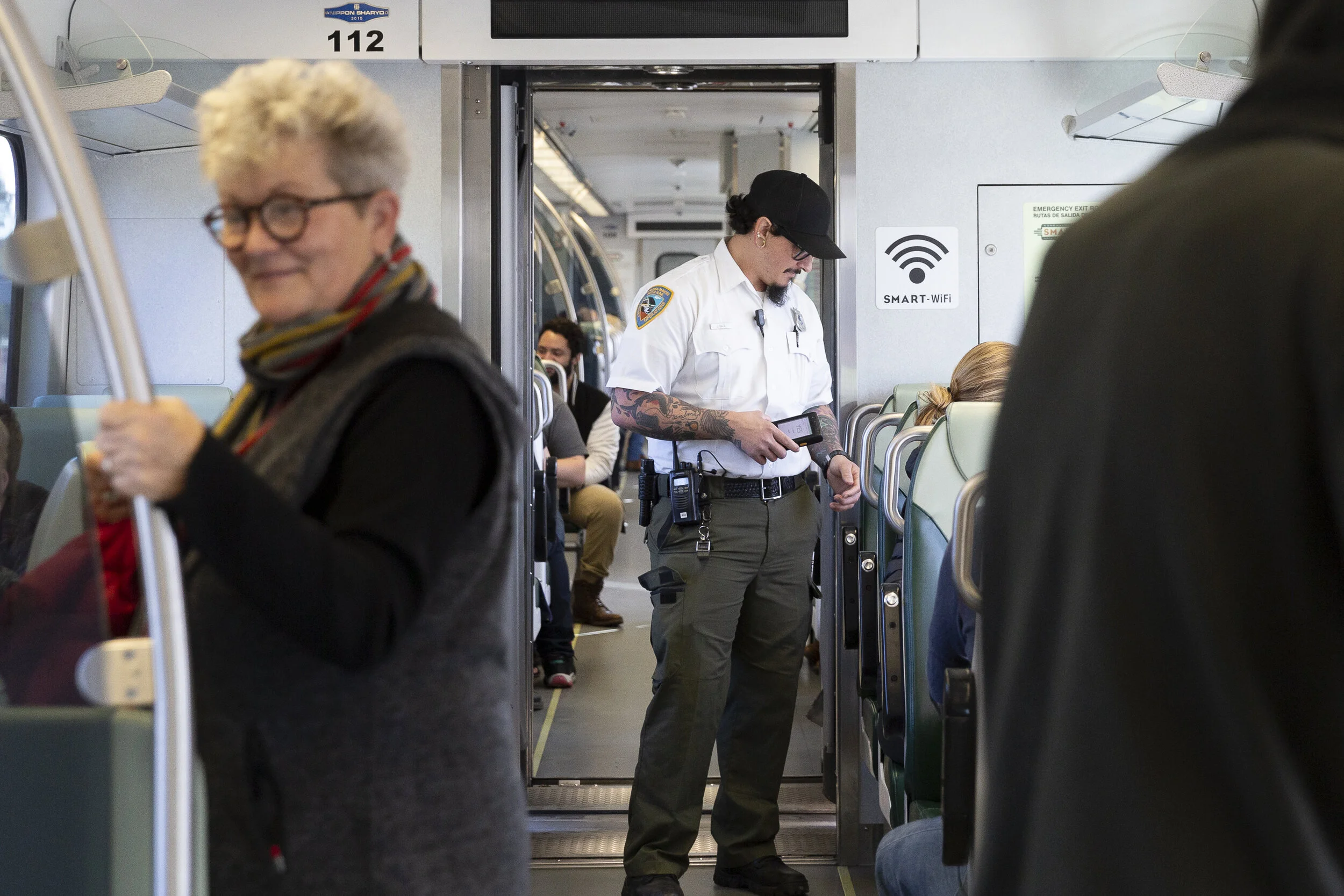 Conductor, Joseph Torrigino-Baca, walks down the aisle verifying CLIPPER cards on the scanner on Sunday, Jan. 5, 2020. (Photo: Genesis Botello)