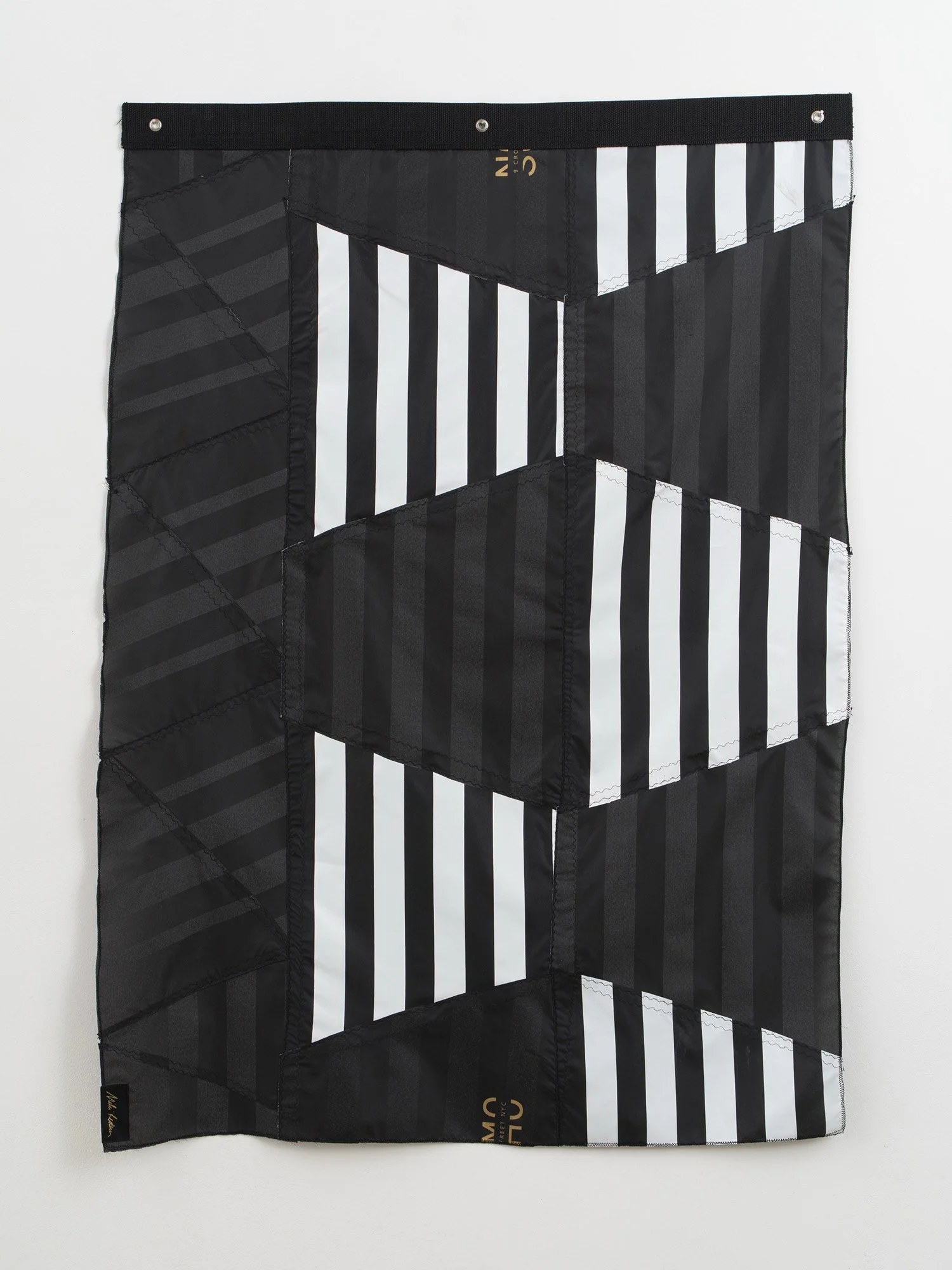 Hanging sculpture made of black and white colored umbrella canopies, nylon thread, nylon webbing, grommets