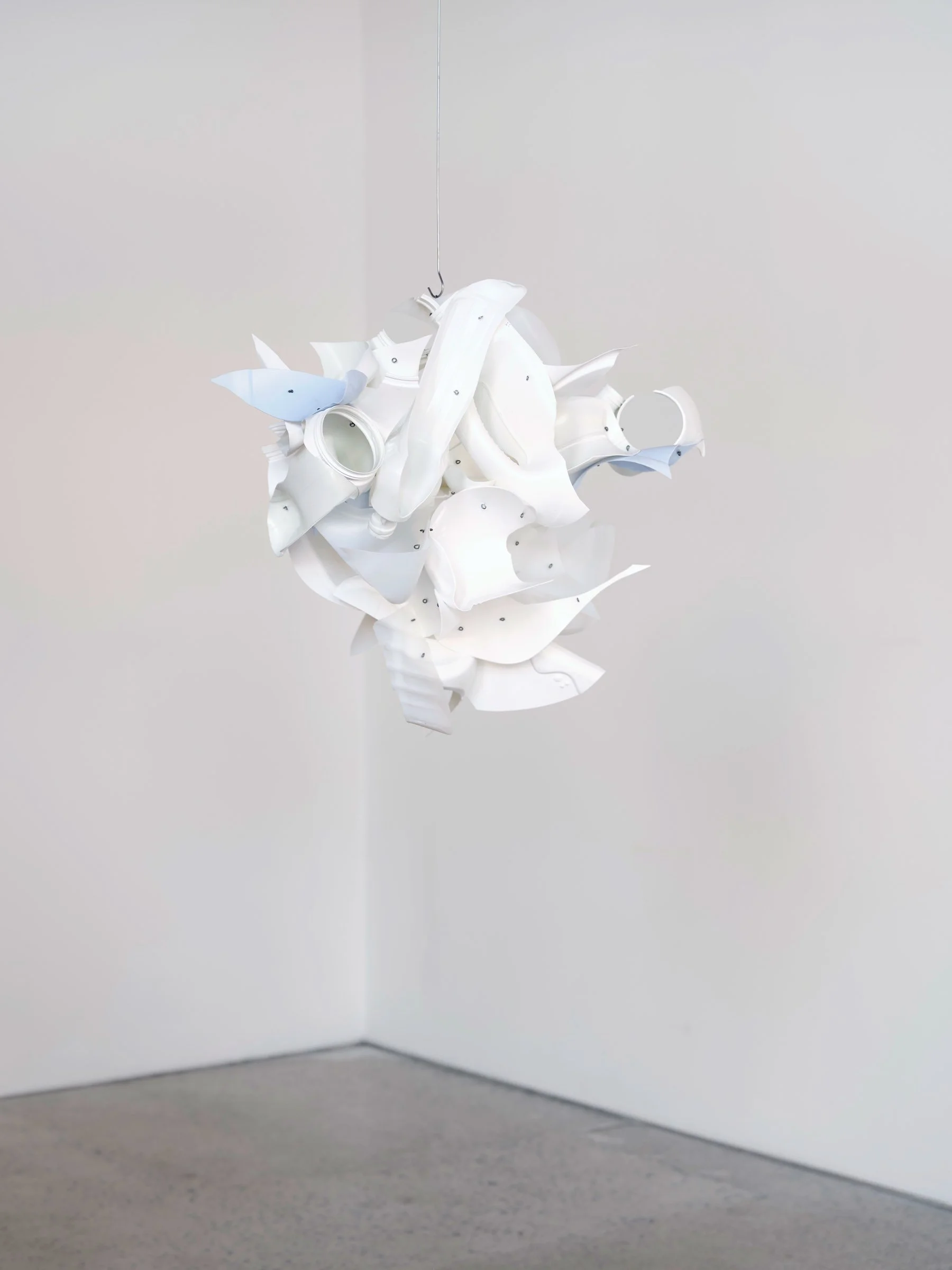 Cloud Car, suspended sculpture of white repurposed plastic fragments forming a clustered abstract shape