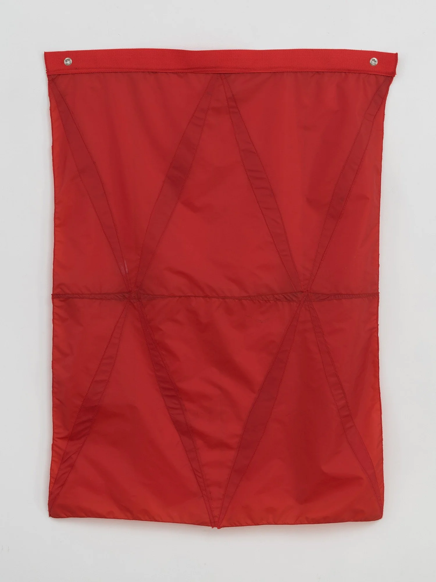 Hanging sculpture made of dark colored umbrella canopies, nylon thread, nylon webbing, grommets