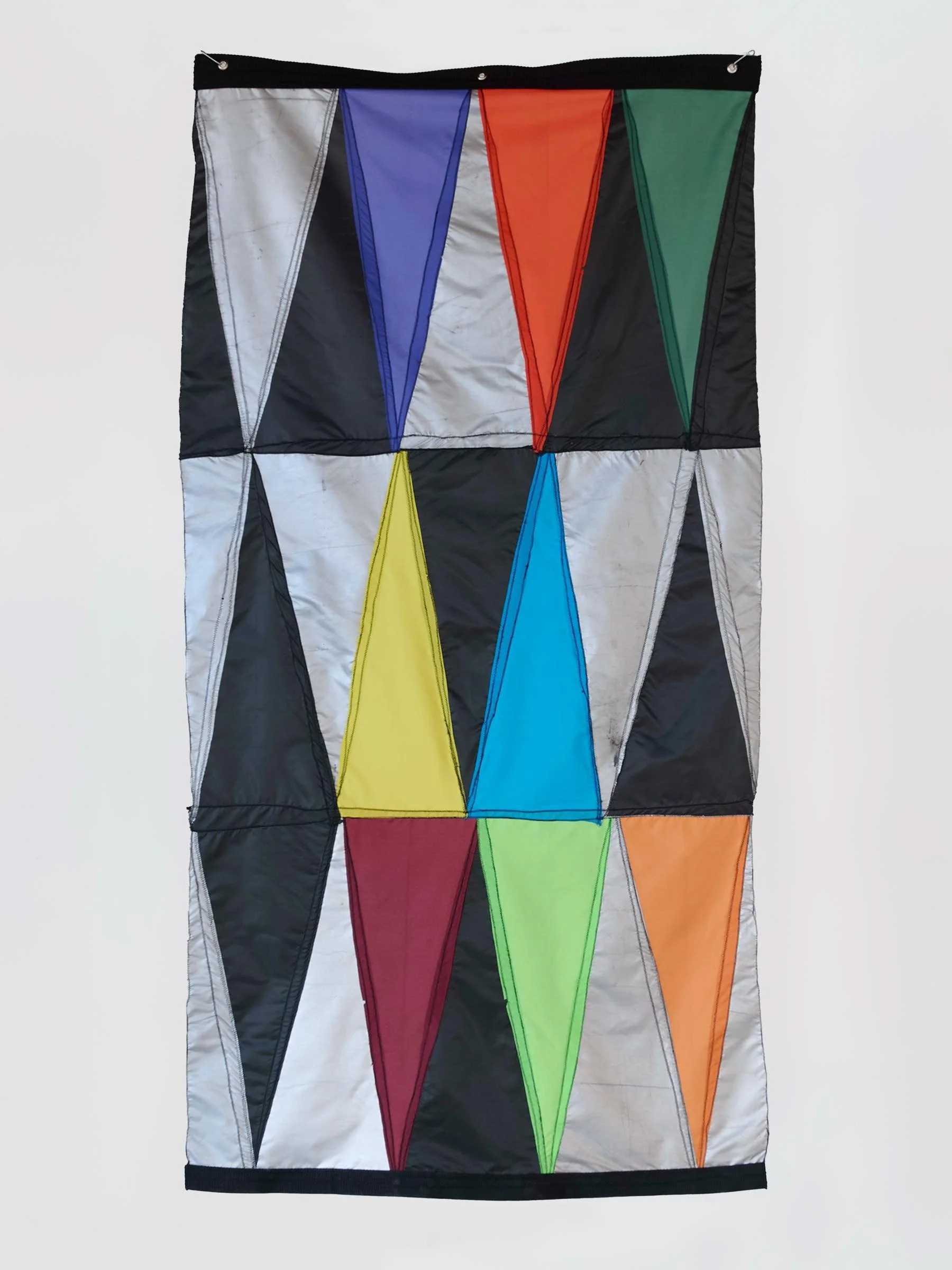 Double Digit Diptych Black, wall-mounted textile artwork with geometric triangular panels in black and multicolored fabric - alternate view