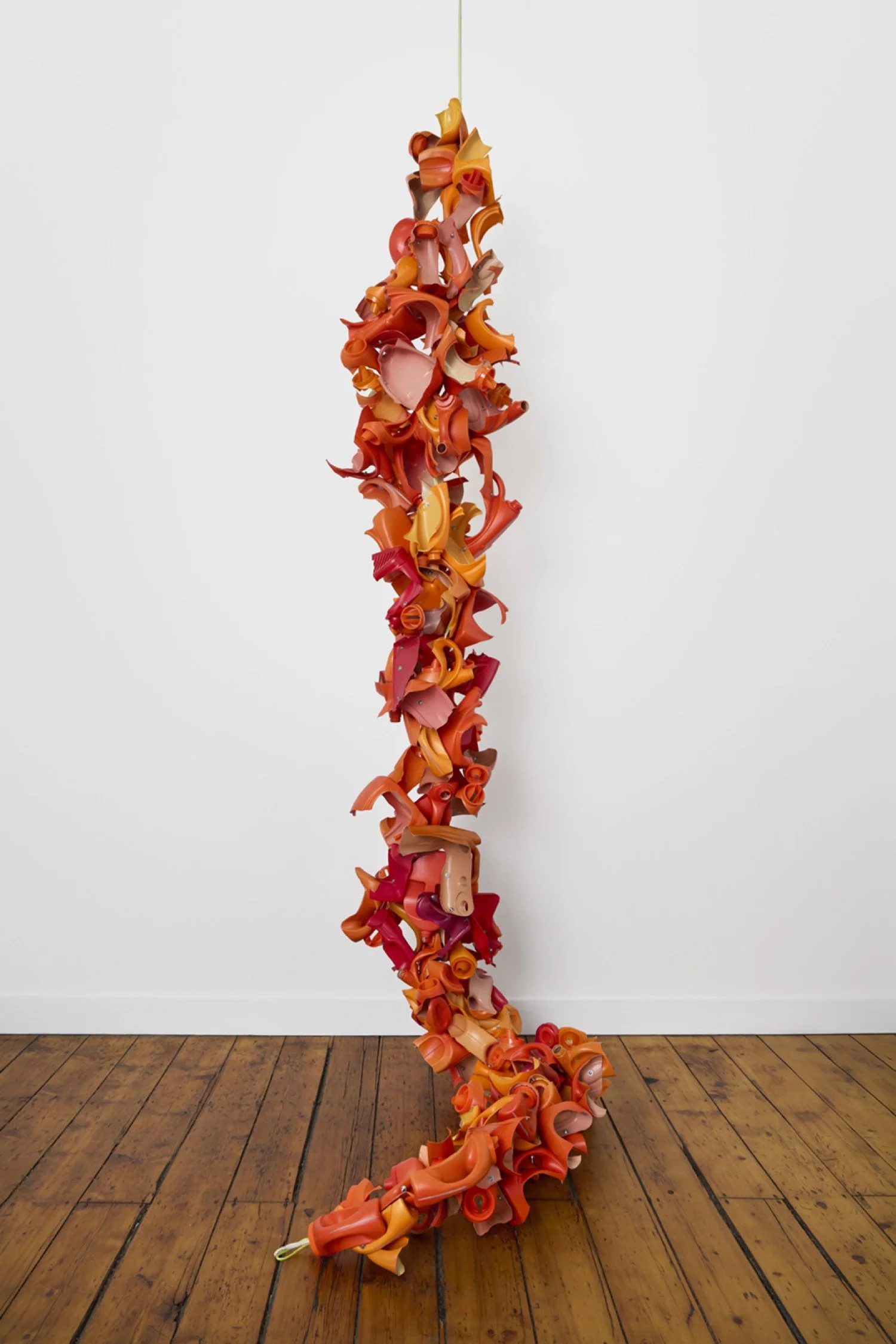 Suspended sculpture made from recycled plastic bottles, machine screws, hex nuts, and nylon rope