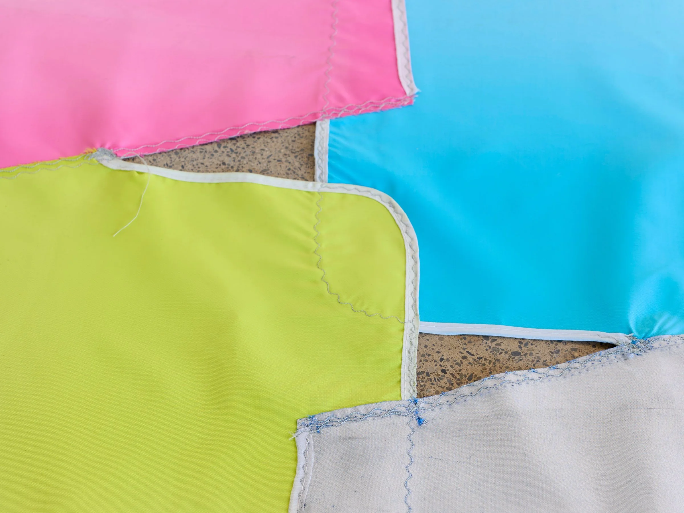 Beach Rio Bingo, detail of multicolored umbrella fabric panels showing stitched seams and layered textile surfaces