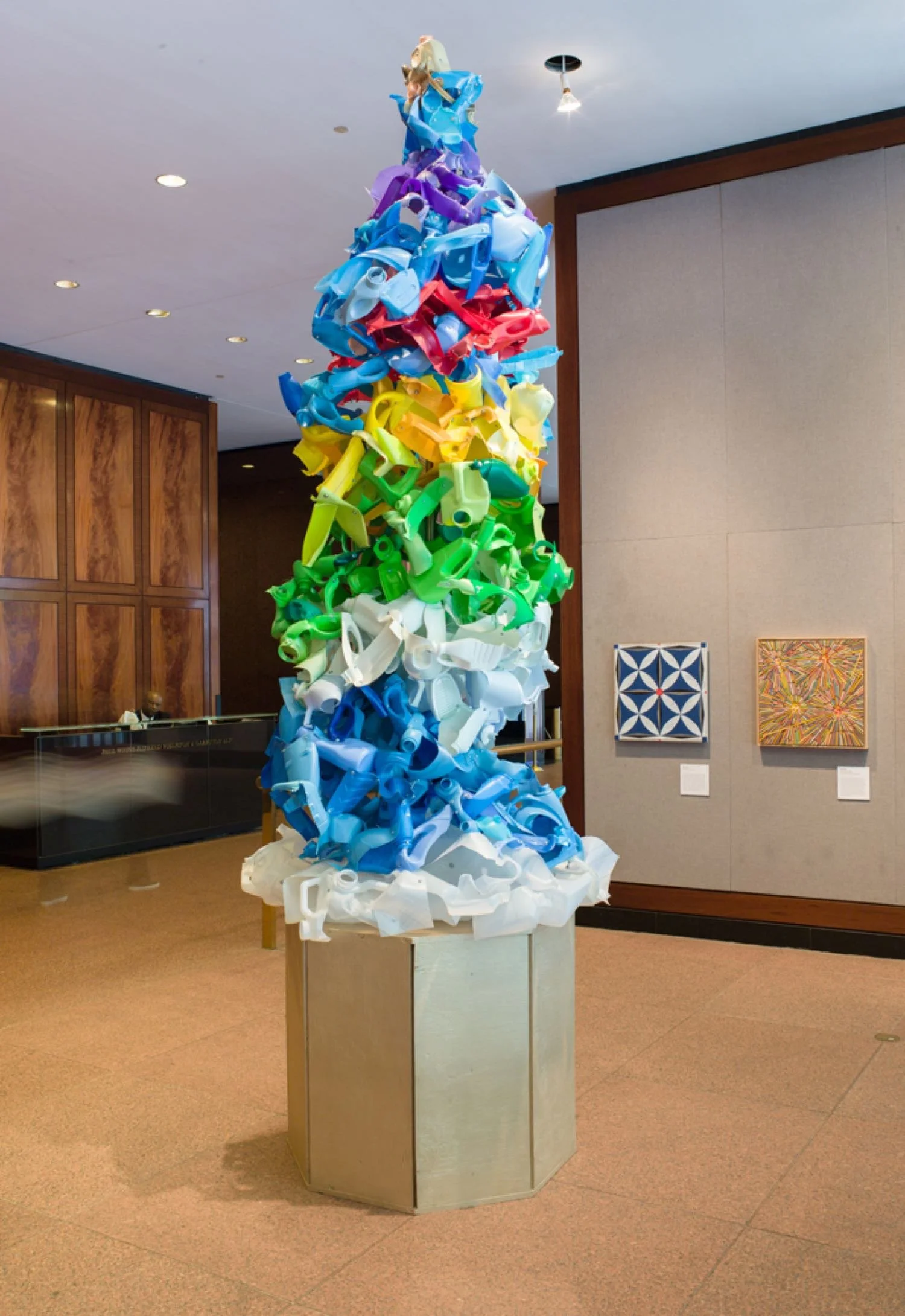 Sculpture made from recycled plastic bottles, machine screws, hex nuts, steel pipe, plywood, acrylic paint