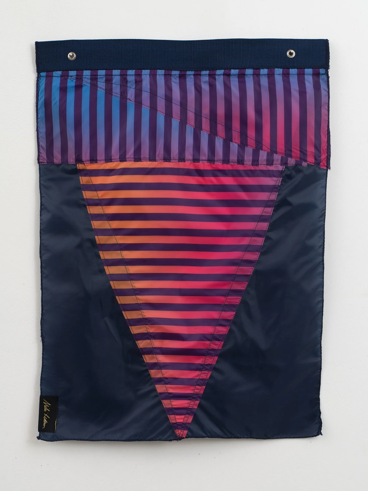 Multicolored flag made from umbrella canopies and nylon thread