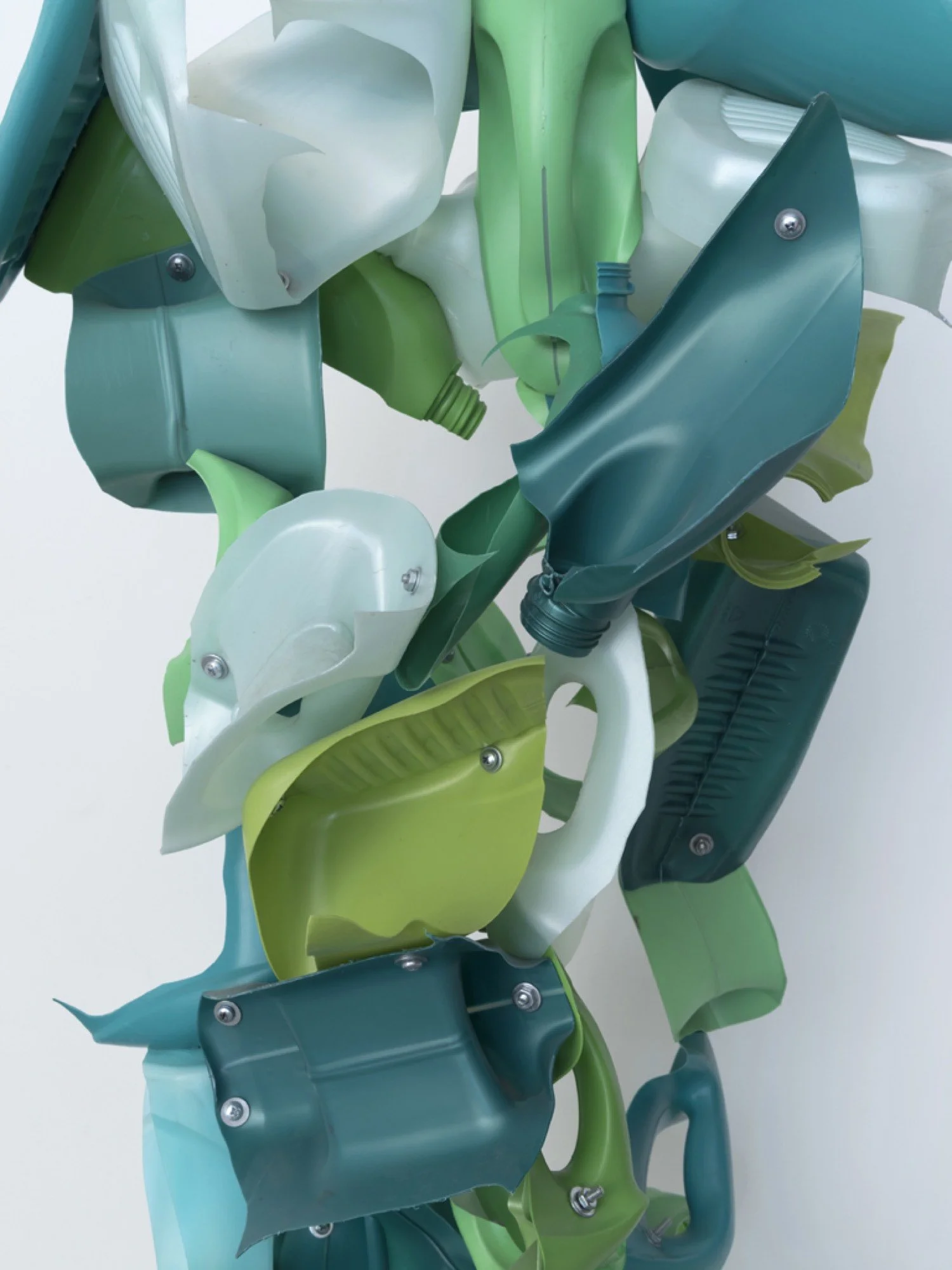 Detail of suspended sculpture made from Gain, Purex, and Cascade detergent bottles, machine screws, hex nuts, and nylon rope