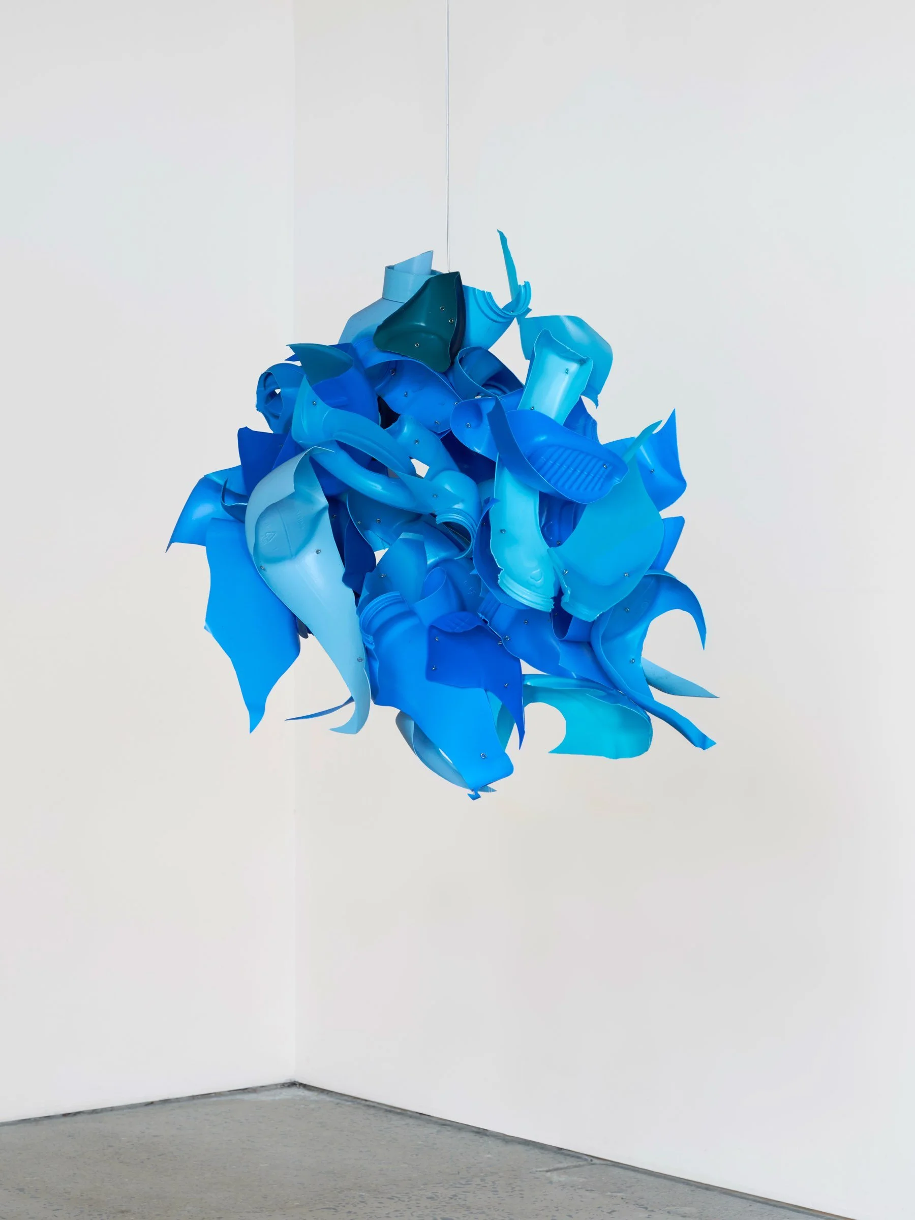 Blue Bonnet, suspended sculpture of layered blue plastic fragments clustered into an organic rounded form