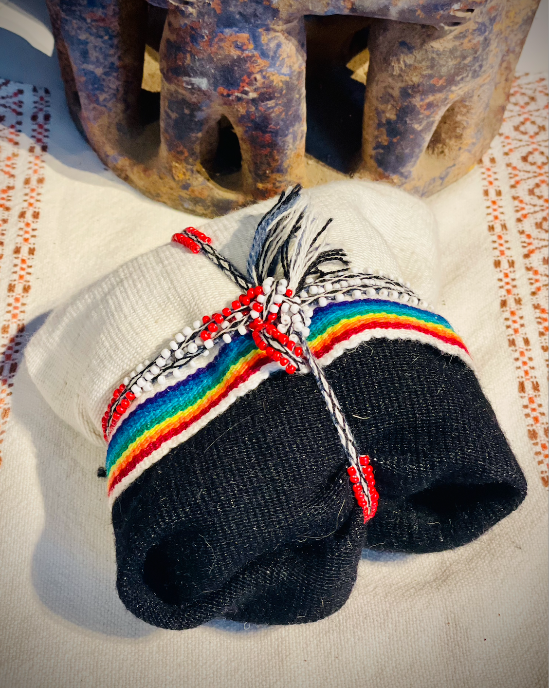 picture of a south american cloth medicine bundle tied and closed