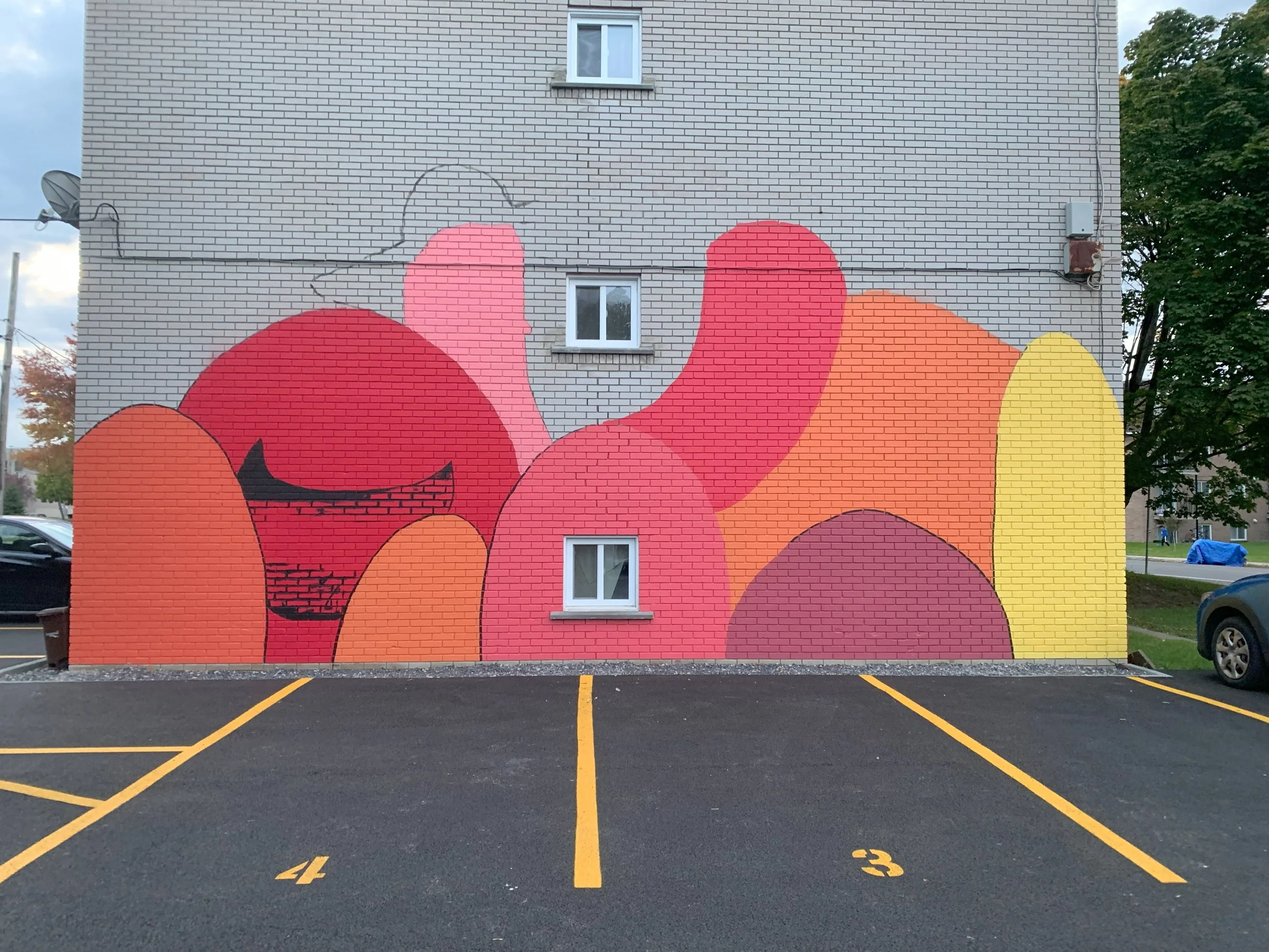 murale et fresque artistique exterieur a longueuil artiste muraliste. la joie rouge artiste muraliste edgar