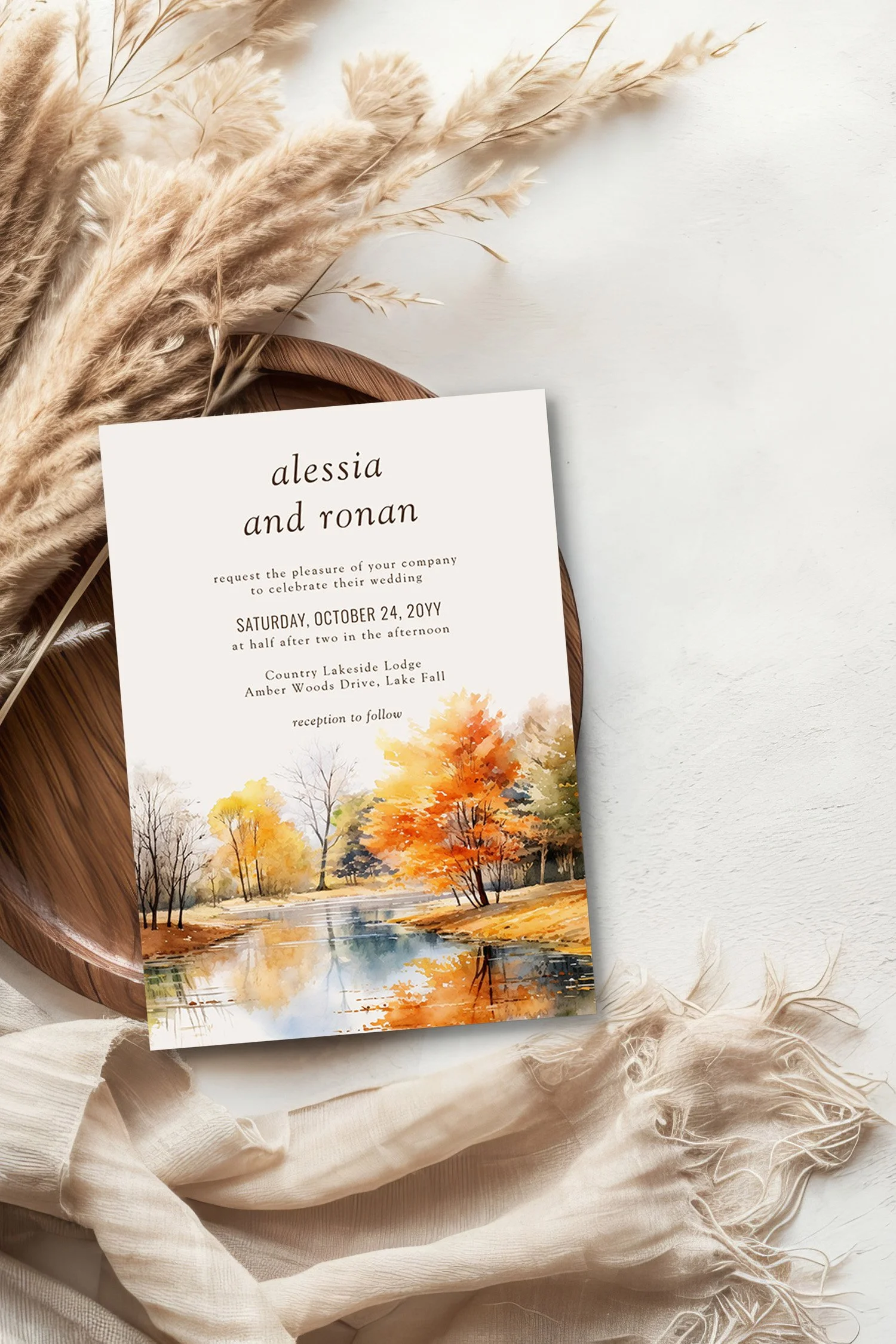 wedding invitation with scenic watercolor illustration of a woodland lake in the fall