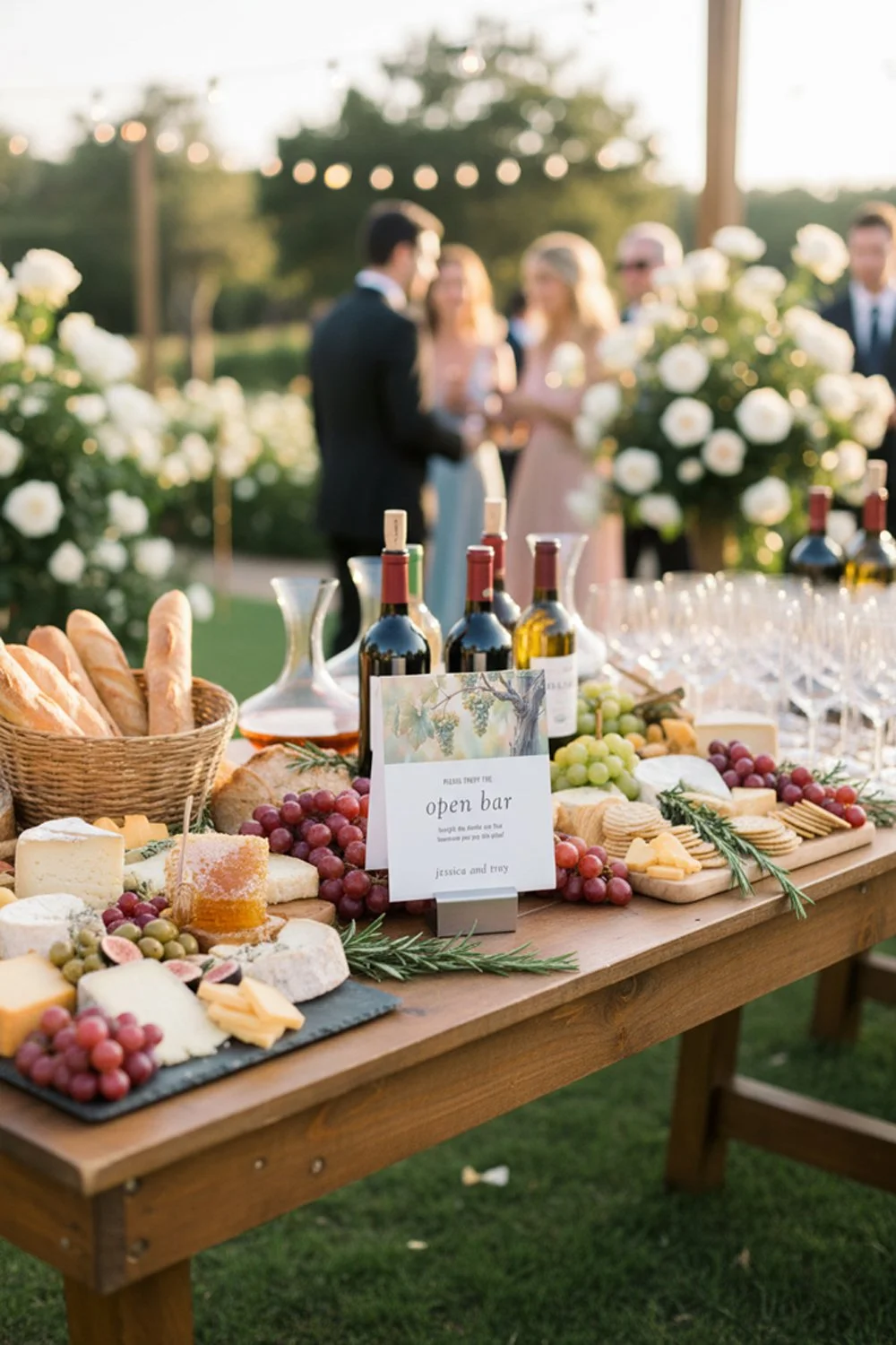 Gourmet wine and cheese tasting station at a vineyard wedding reception.