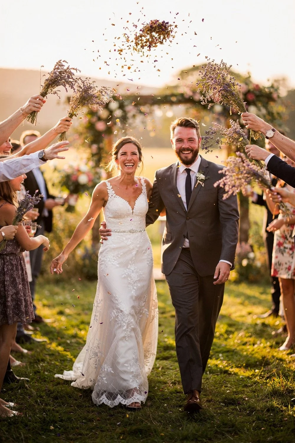 guests throwing wildflower petals like confetti