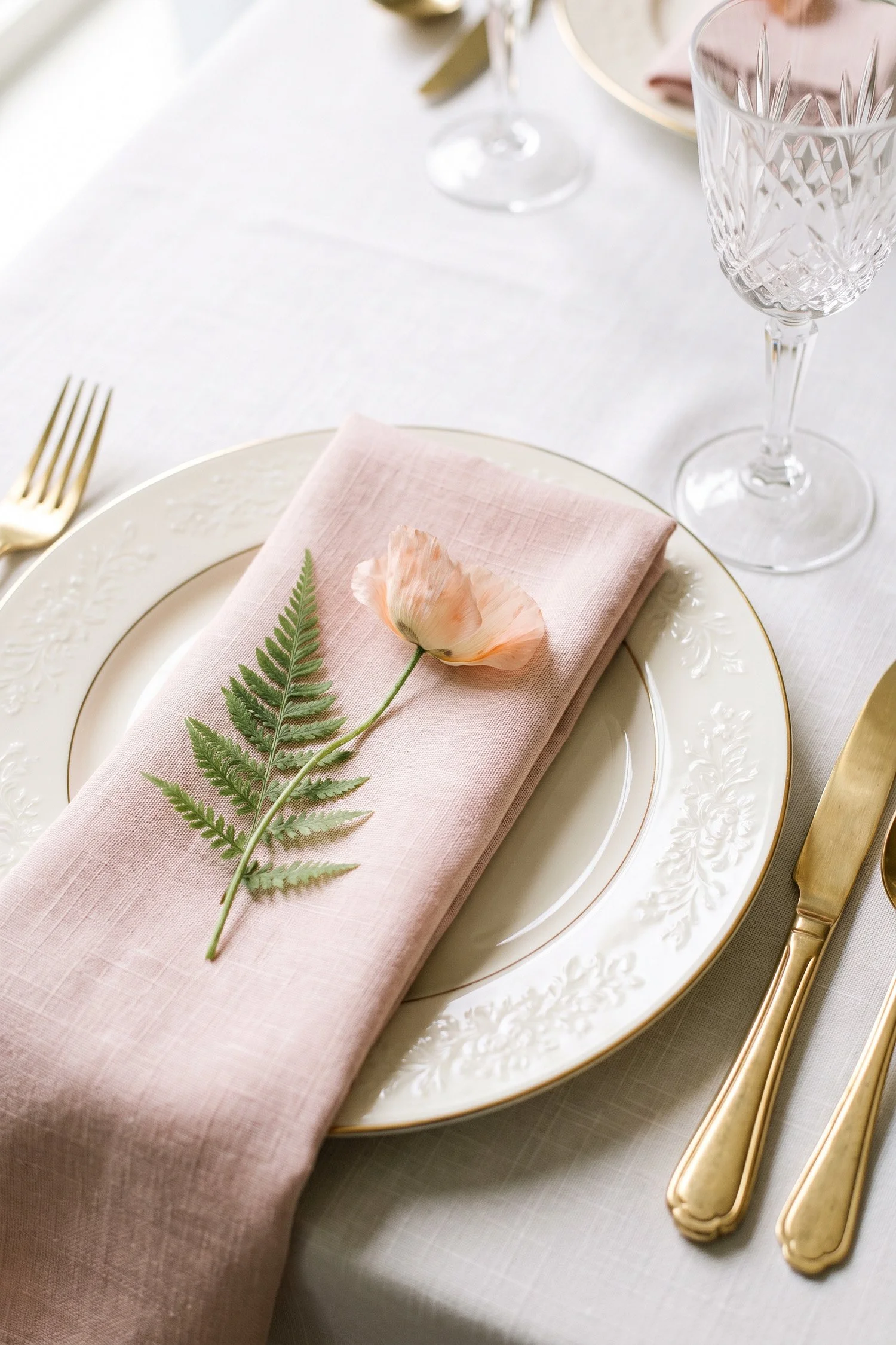 Fine-art wedding photography close-up detail shot of an aesthetic reception place setting