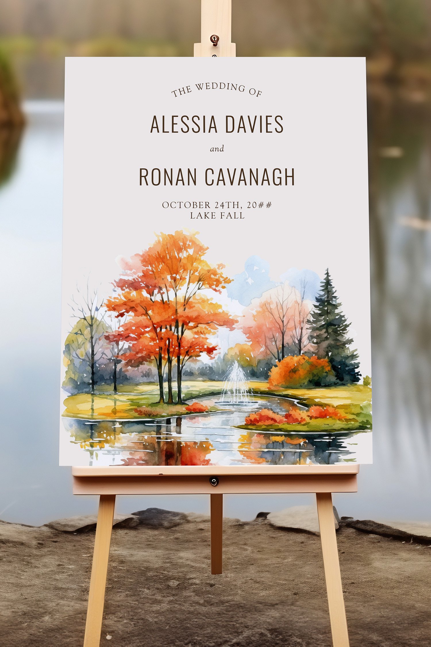 Wedding welcome sign with fall themed woodsy parkland by the lake
