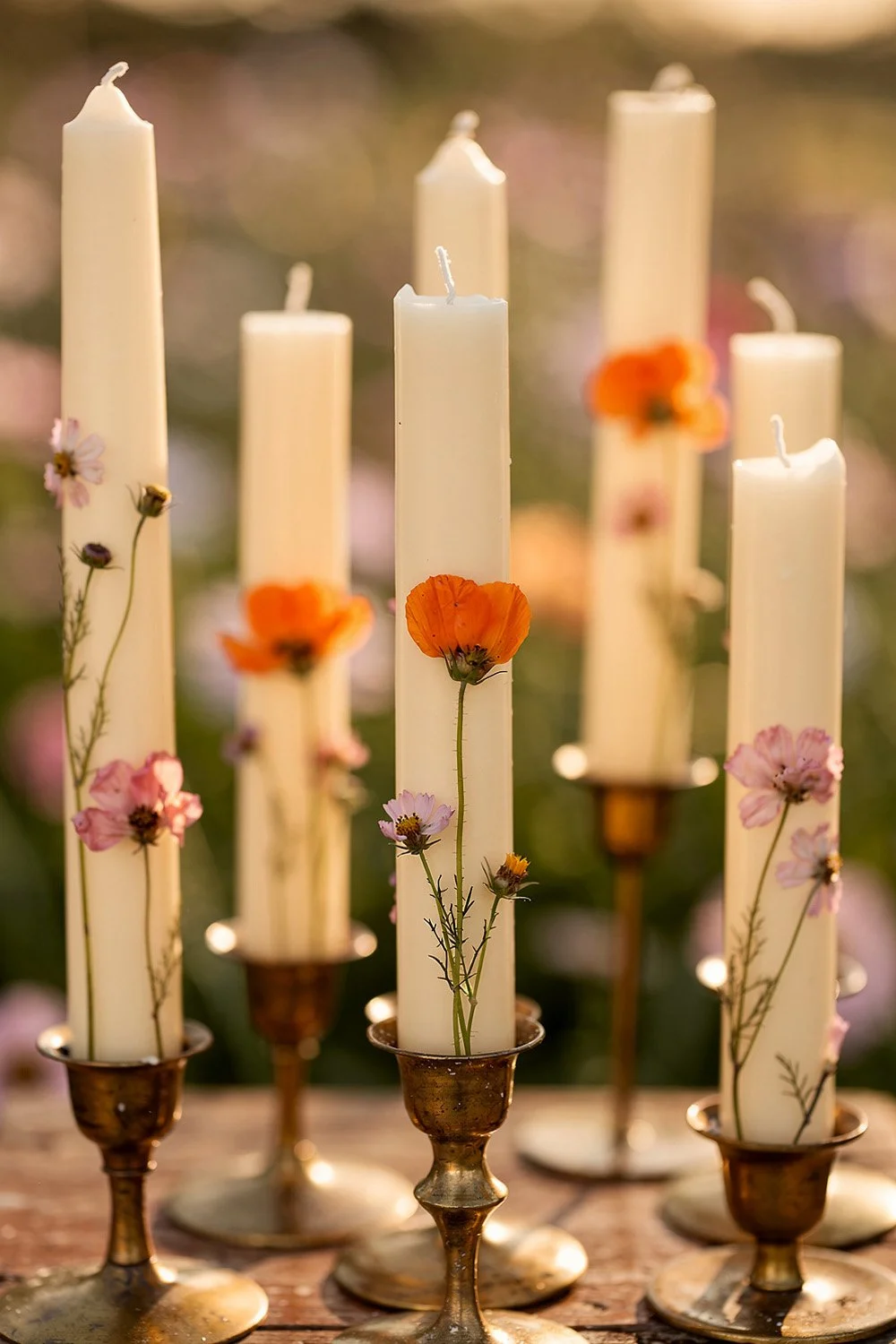 Taper candles embedded with real pressed wildflowers