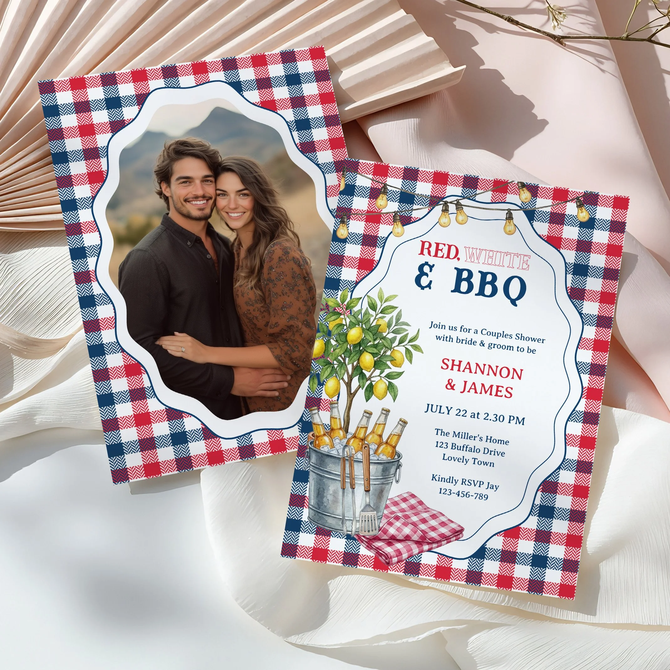 Get ready for a fun summer celebration with this chic Red, White, and BBQ couples shower invitation! Featuring bespoke digital artwork of a fresh lemon tree, a rustic backyard beer bucket, and classic navy and red gingham plaid, this design is perfec
