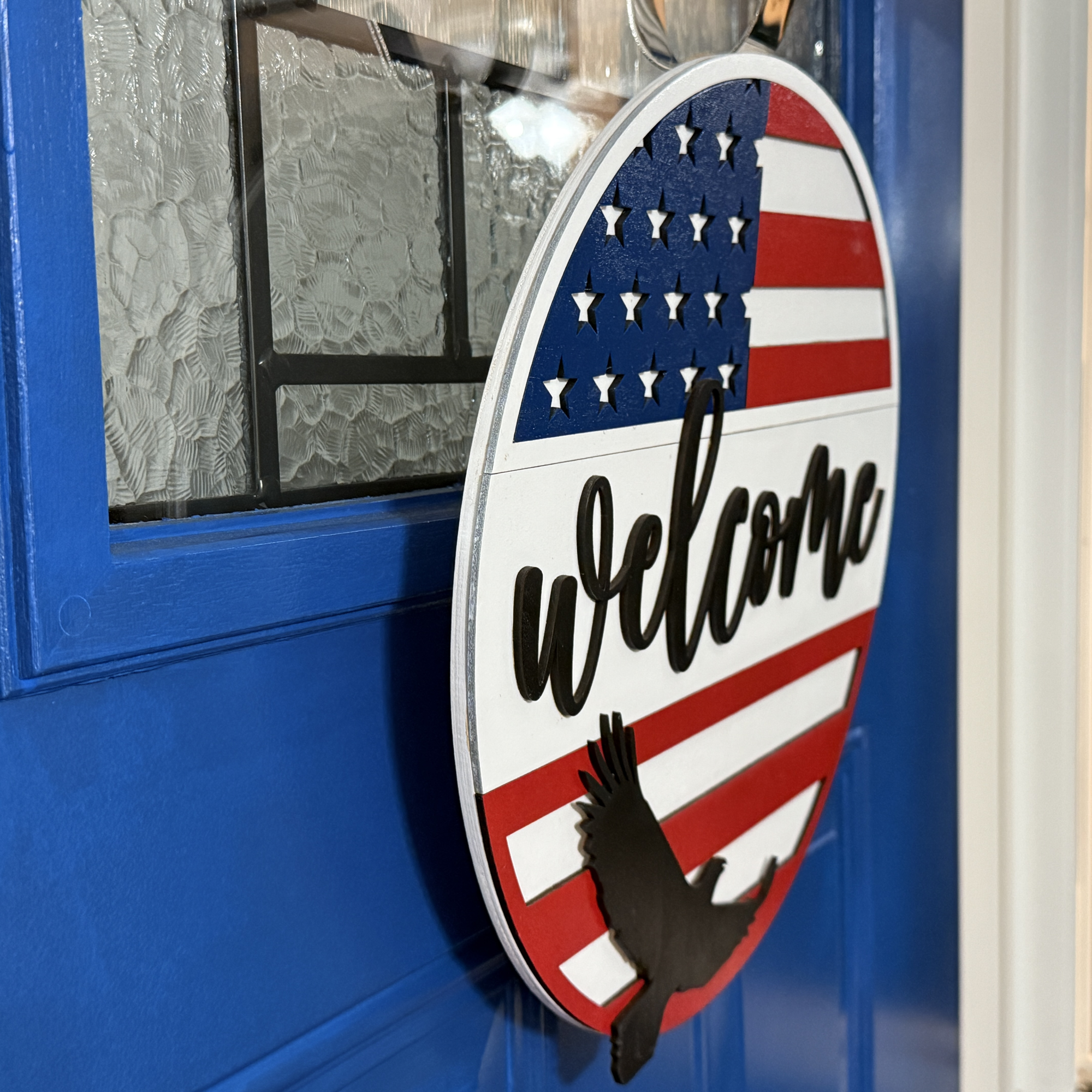 Patriotic Eagle door hanger, side view, showing base thickness and layered wood details