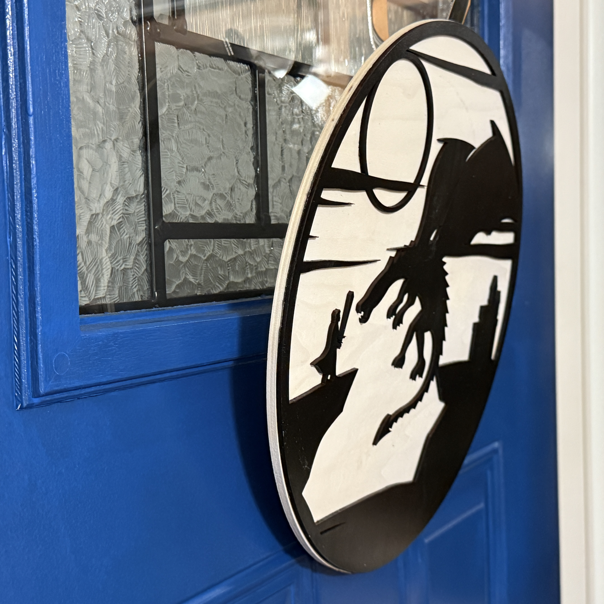 Dragon Fighter door hanger, side view, showing base thickness and layered wood details