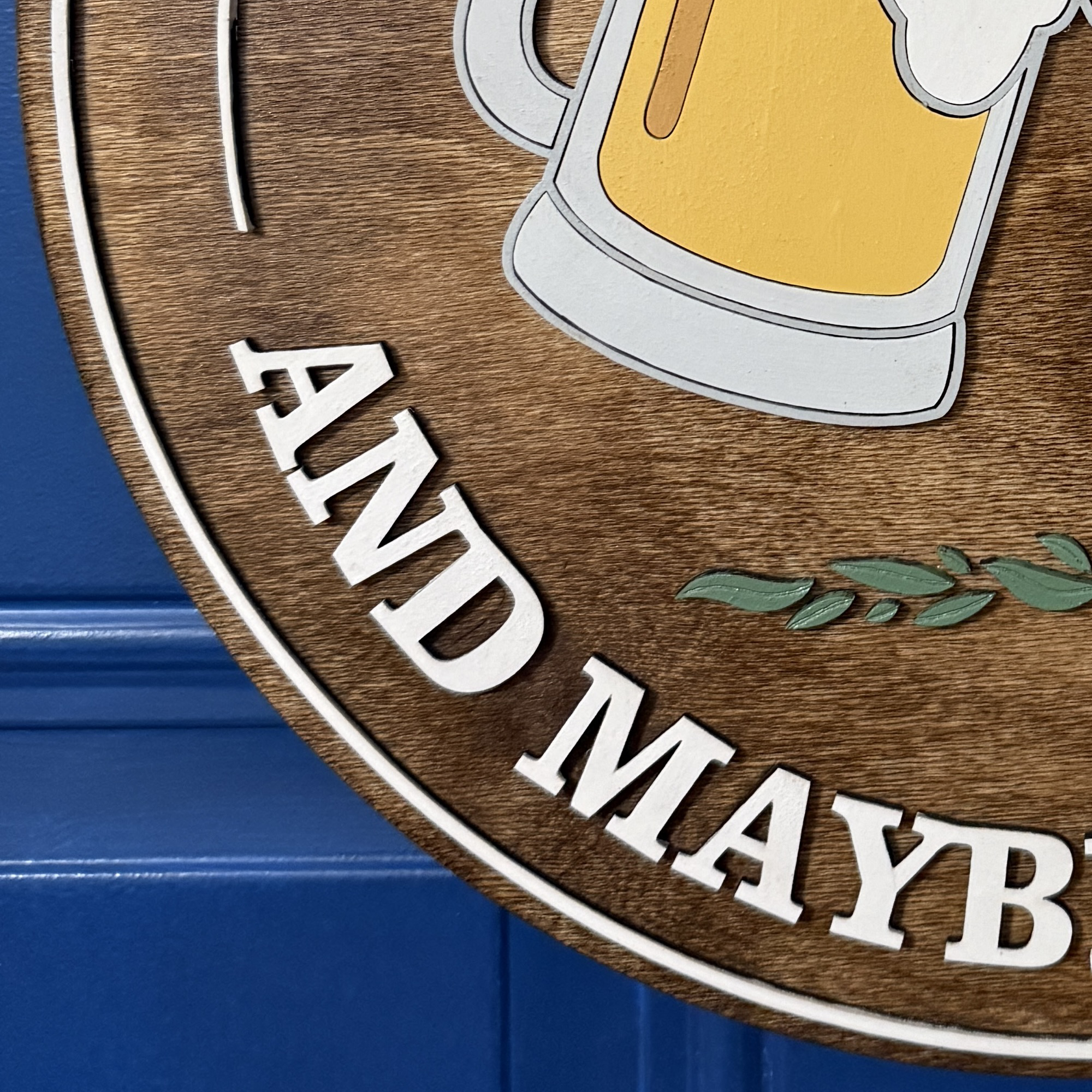 Close-up of painted beer mugs with yellow fill and white foam detail