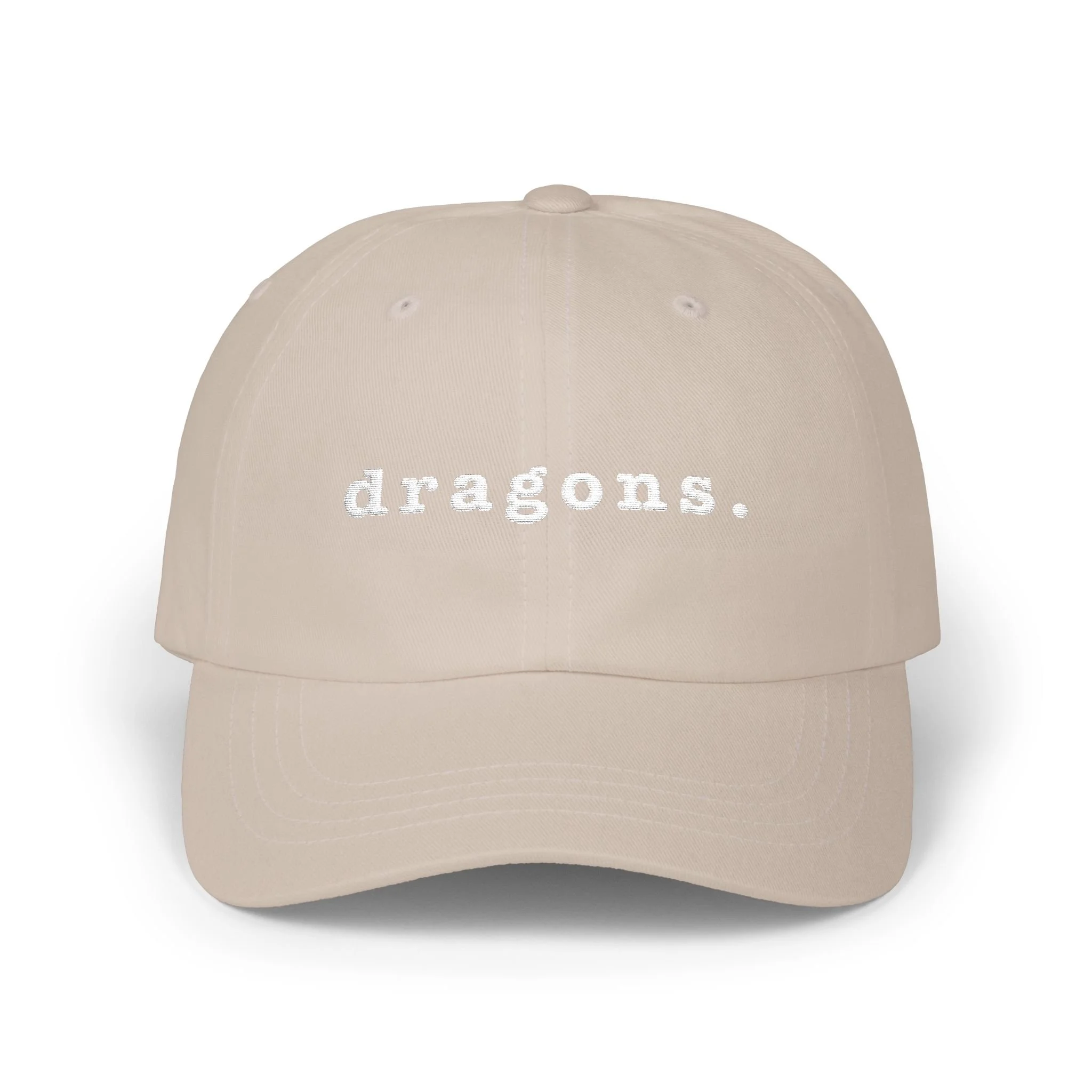 Stone dad cap on white background displaying embroidered “dragons.” text on the front.