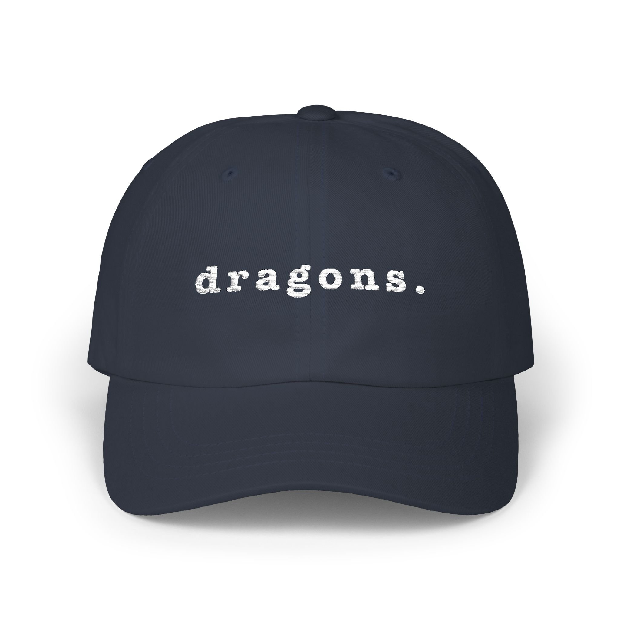 Navy dad cap on white background displaying embroidered “dragons.” text on the front.