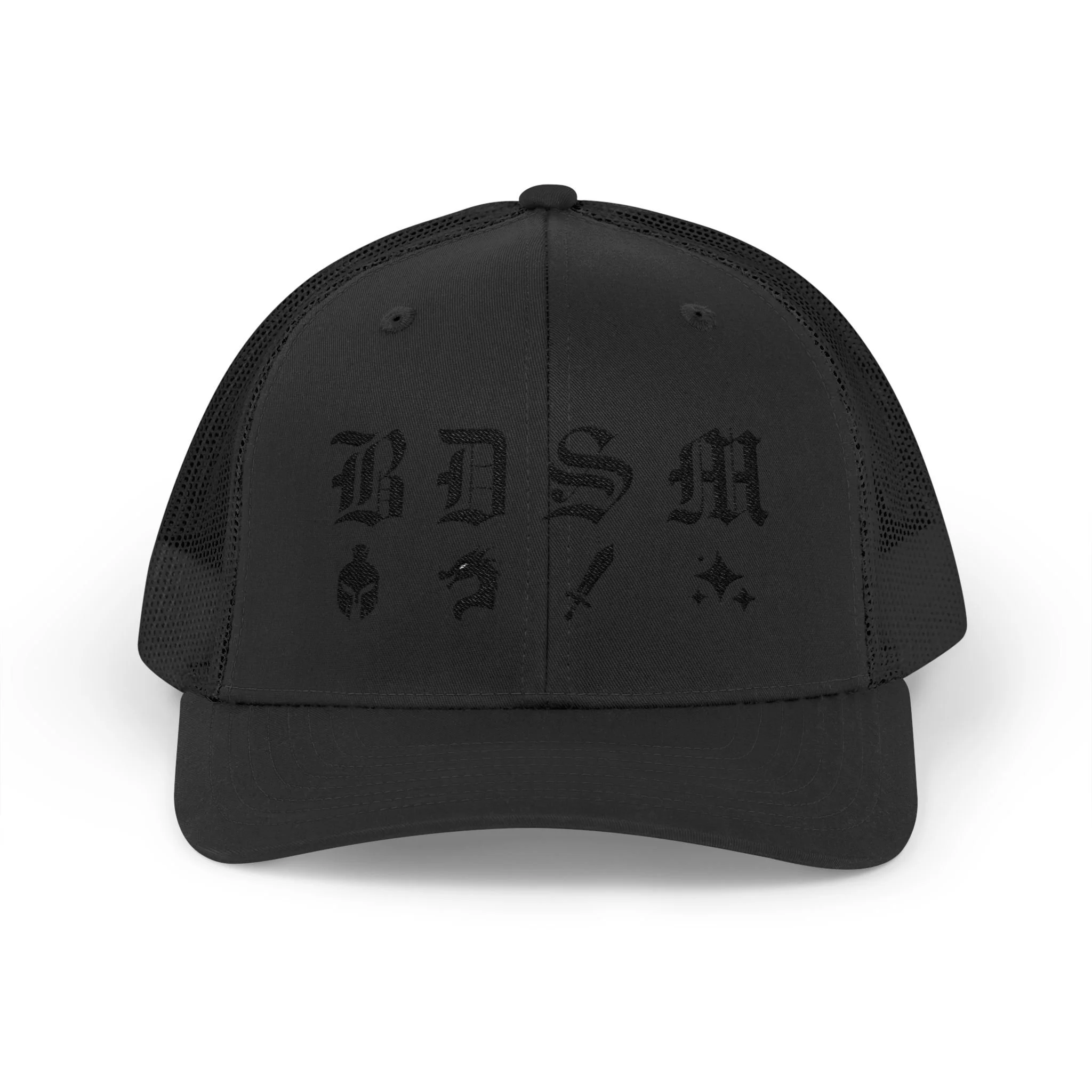 Front view of black embroidered trucker cap with “BDSM” gothic initials above helmet, dragon, sword, and star icons.
