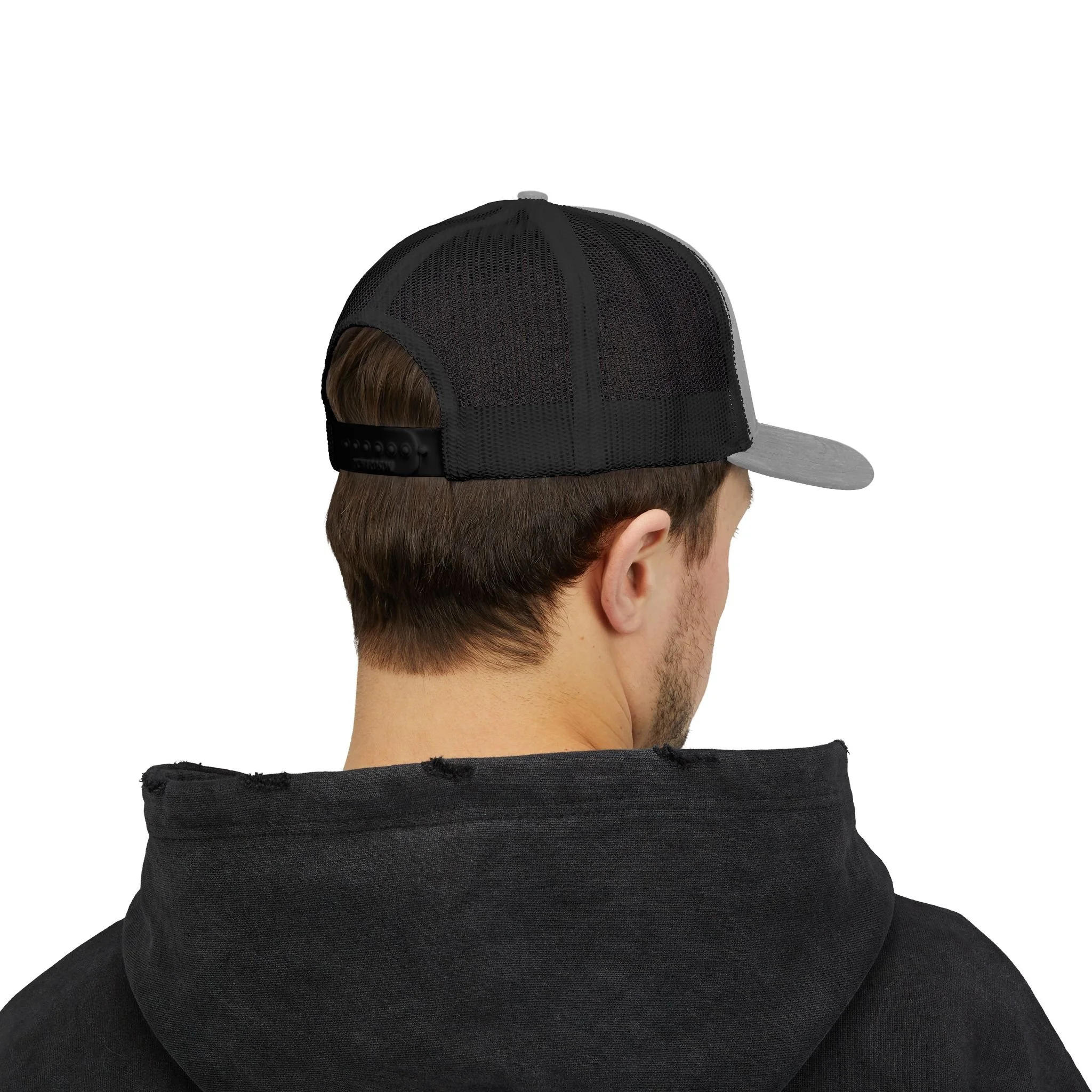 Back view of man wearing black embroidered trucker cap, showing mesh panels and snapback closure.