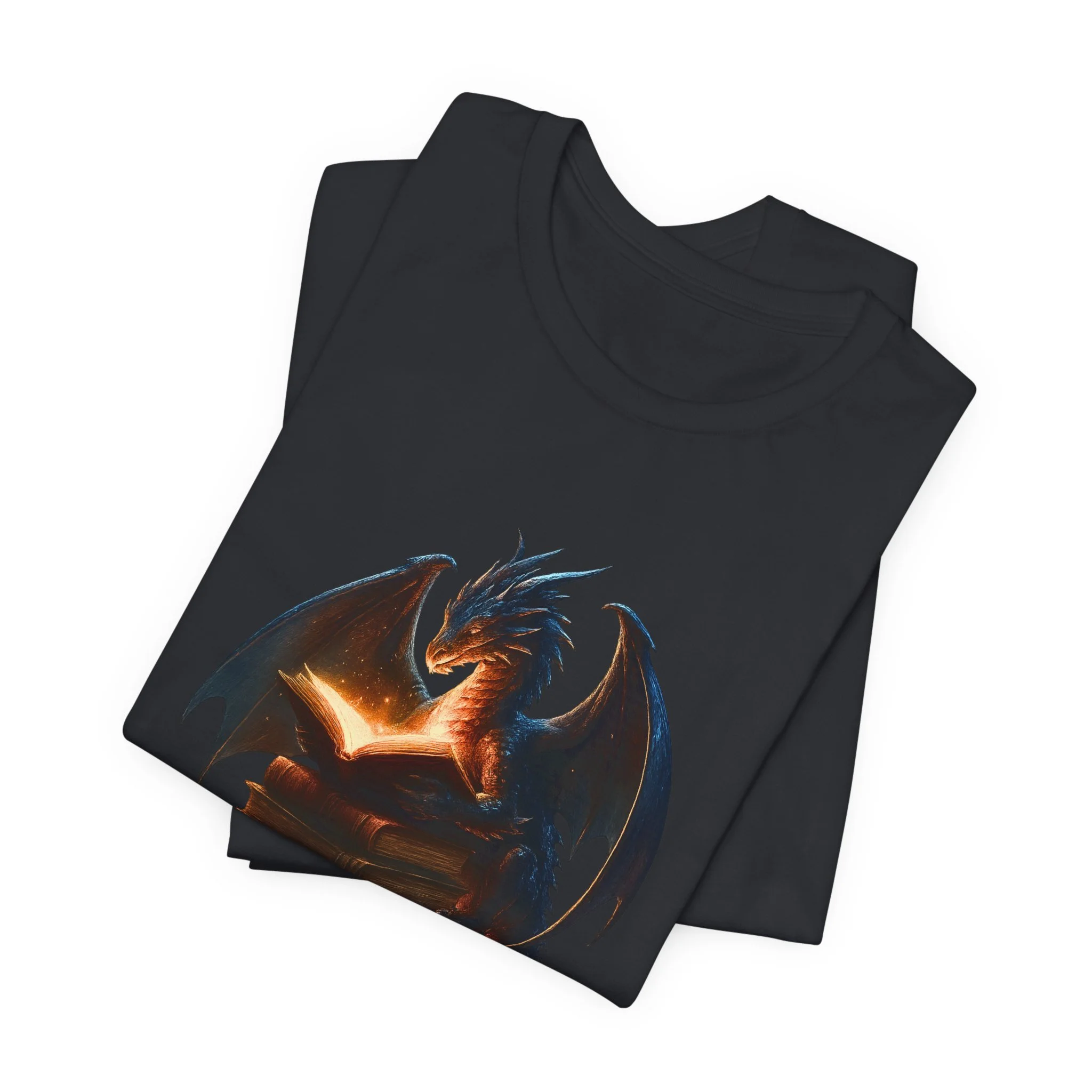 Folded vintage black t-shirt with vibrant dragon and glowing book illustration
