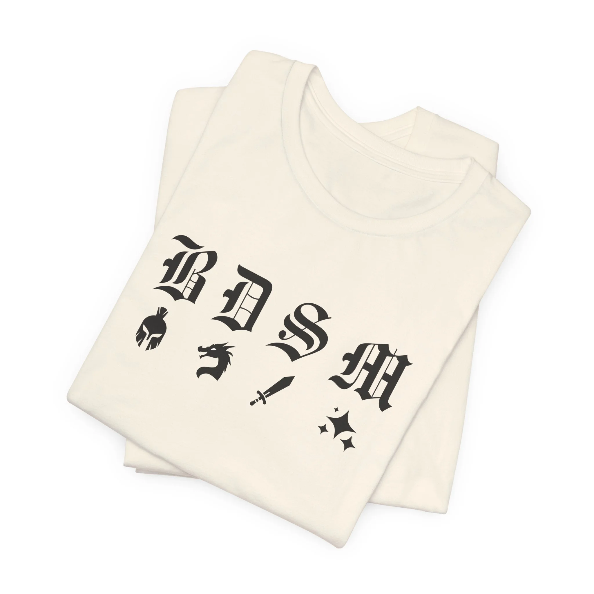 Folded natural color t-shirt with black fantasy BDSM lettering and matching icons