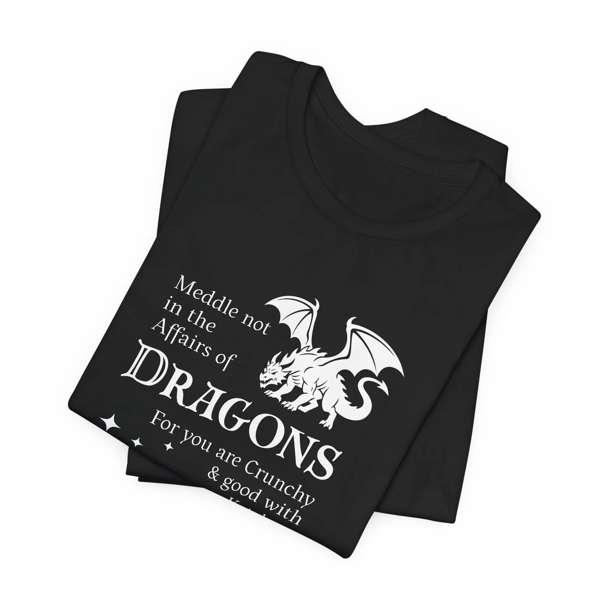 Folded black dragon quote t-shirt with bright white dragon graphic and fantasy text.