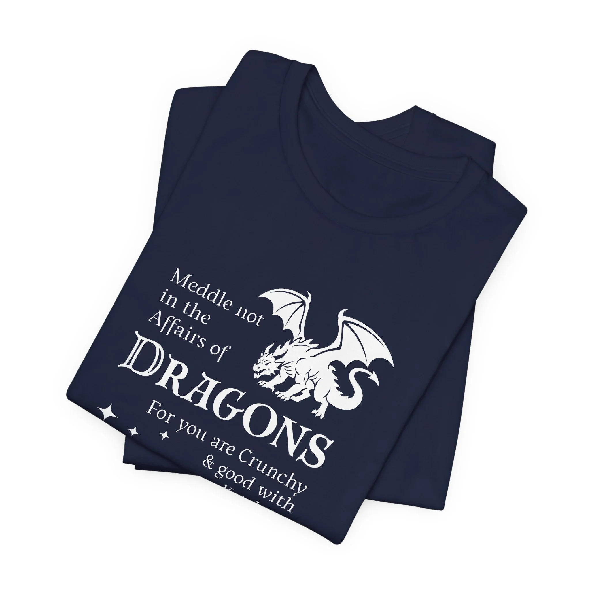 Folded navy blue dragon quote t-shirt with white artwork and scattered star elements.