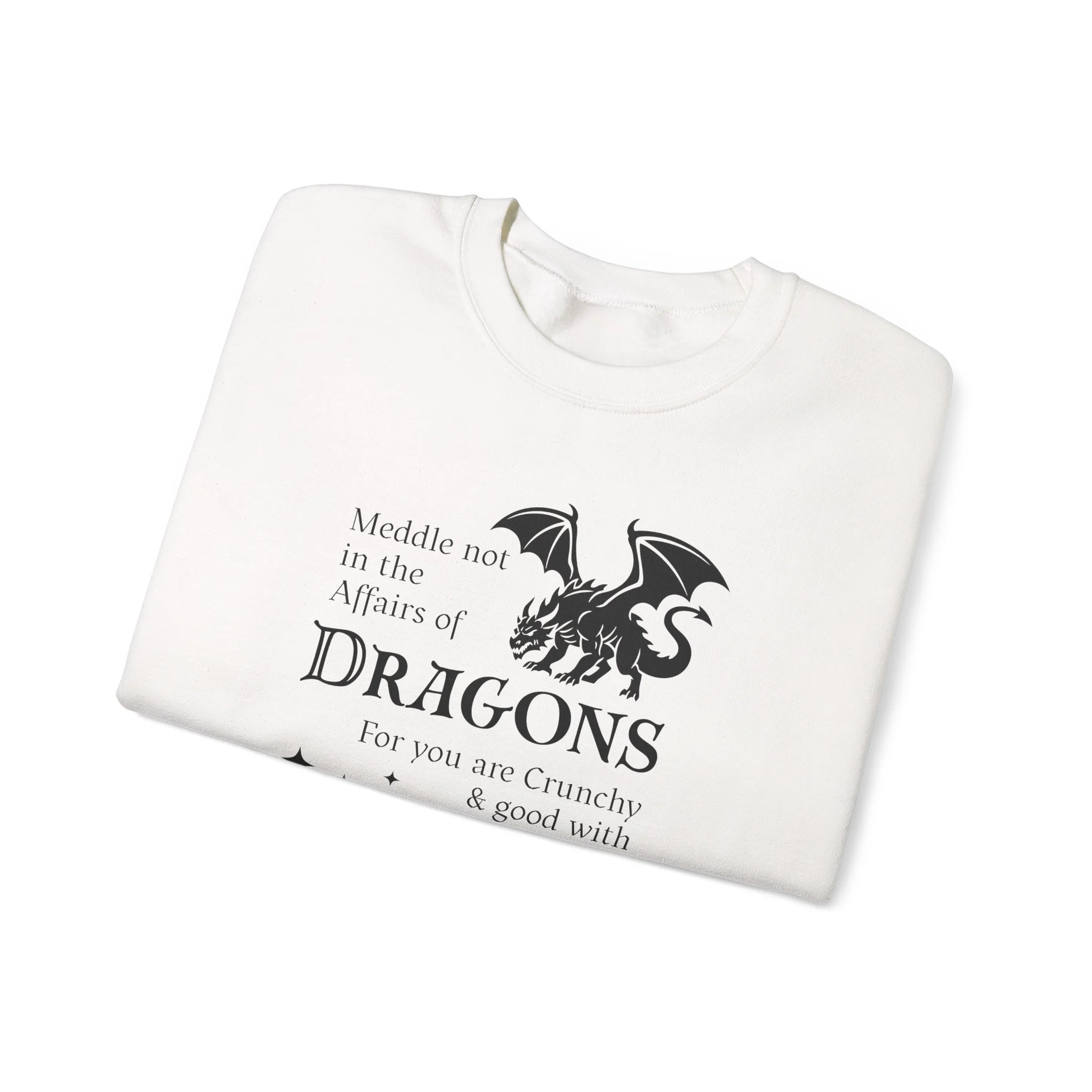 White folded crewneck featuring black dragon artwork and the phrase “Meddle not in the affairs of dragons.”