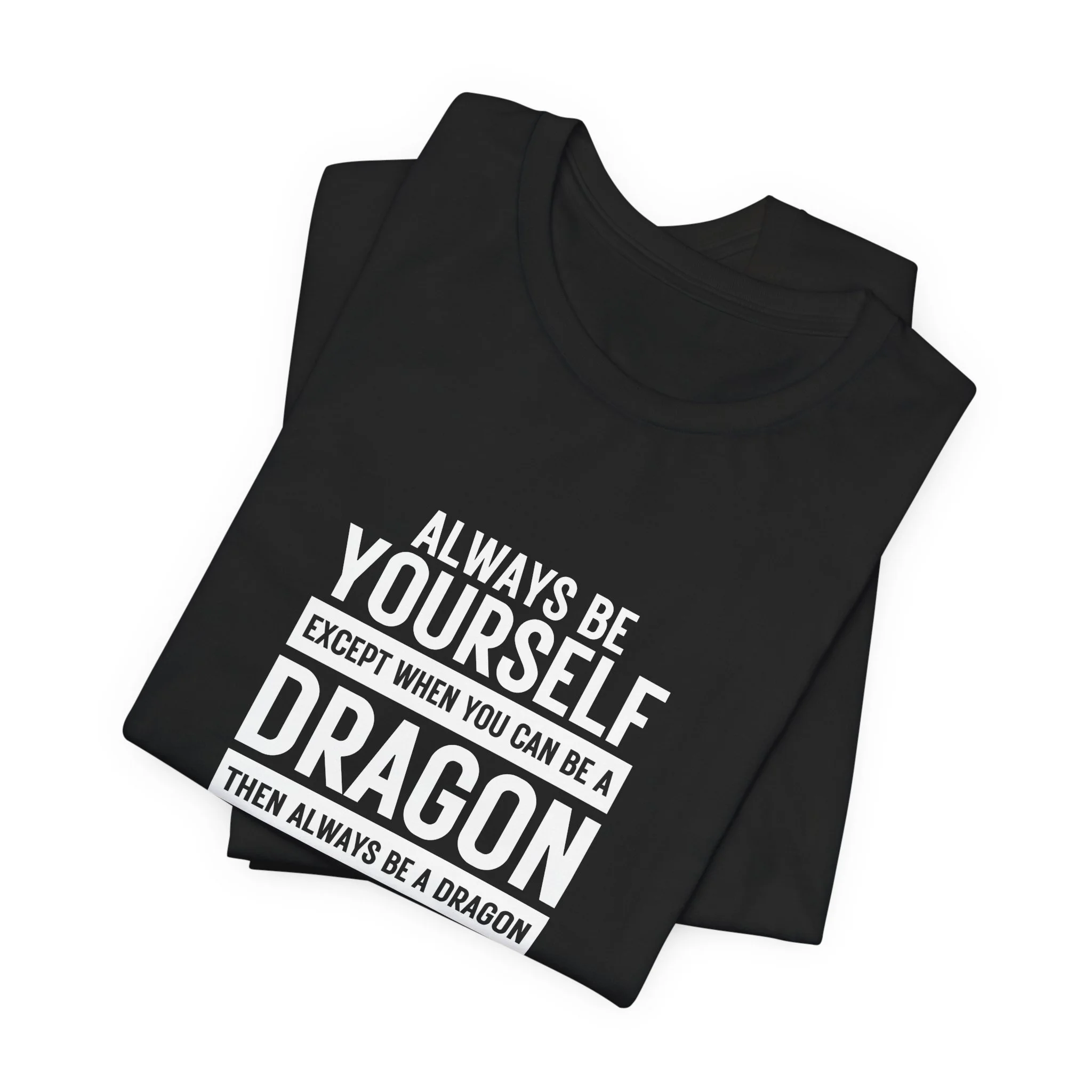 Folded black T-shirts featuring bold dragon quote text centered on the chest.