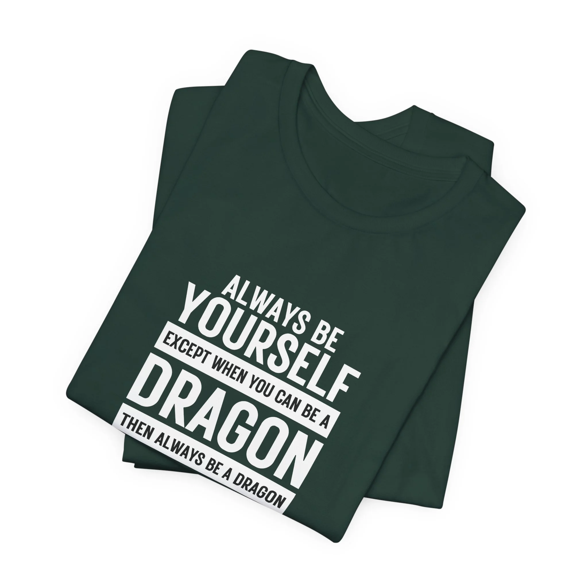 Folded forest green T-shirt with white dragon quote typography centered on the front.