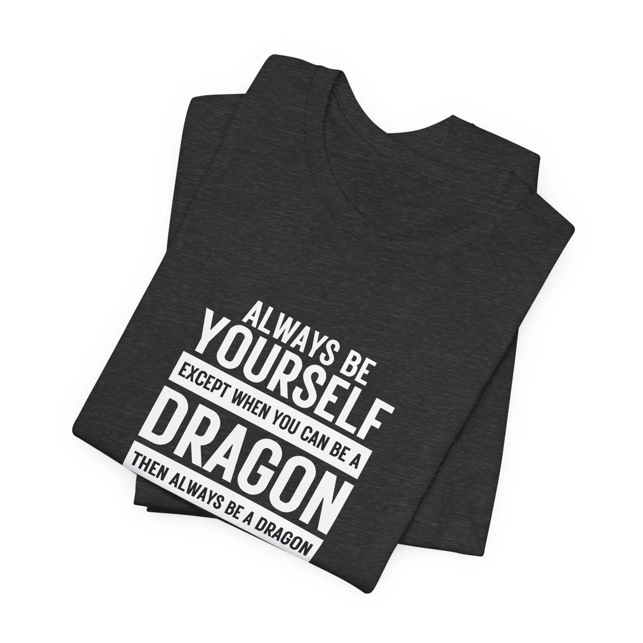 Folded dark heather gray T-shirt with white block-style dragon quote design.
