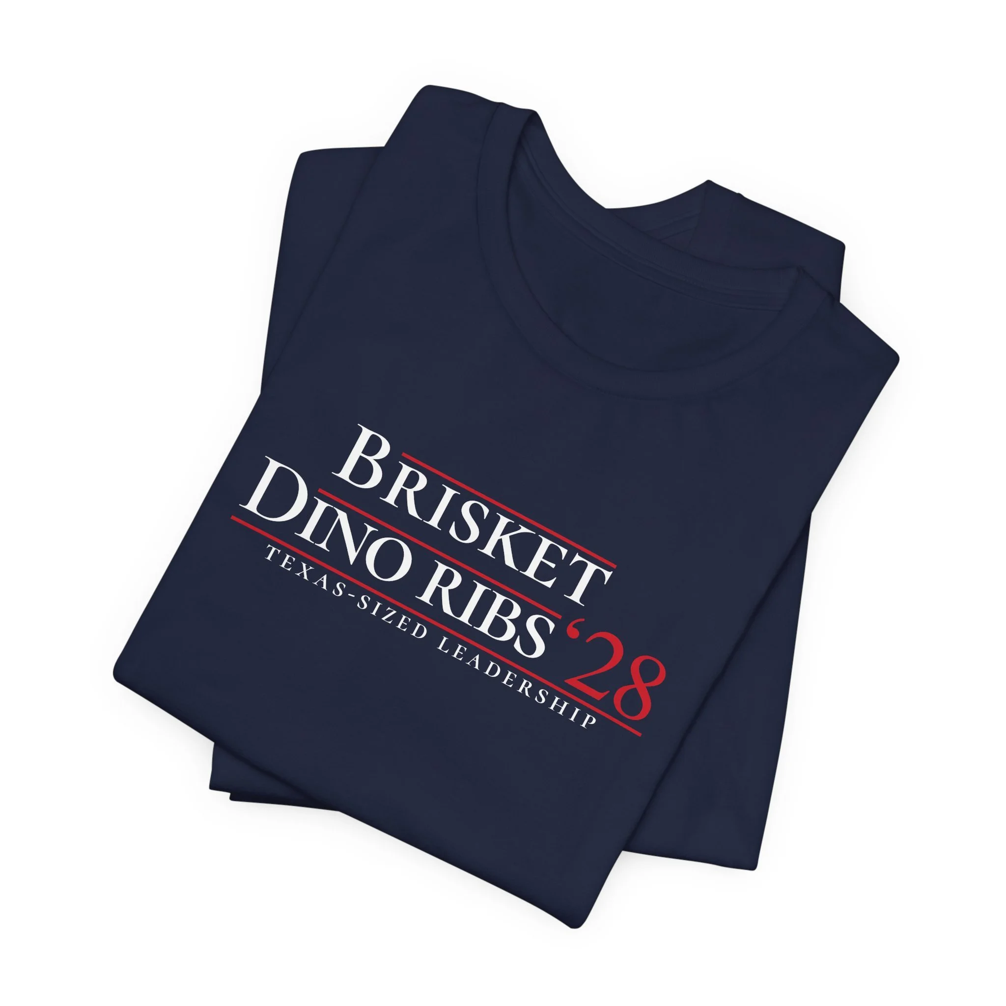 Folded navy Brisket Dino Ribs ’28 campaign parody tees stacked together on a white background.