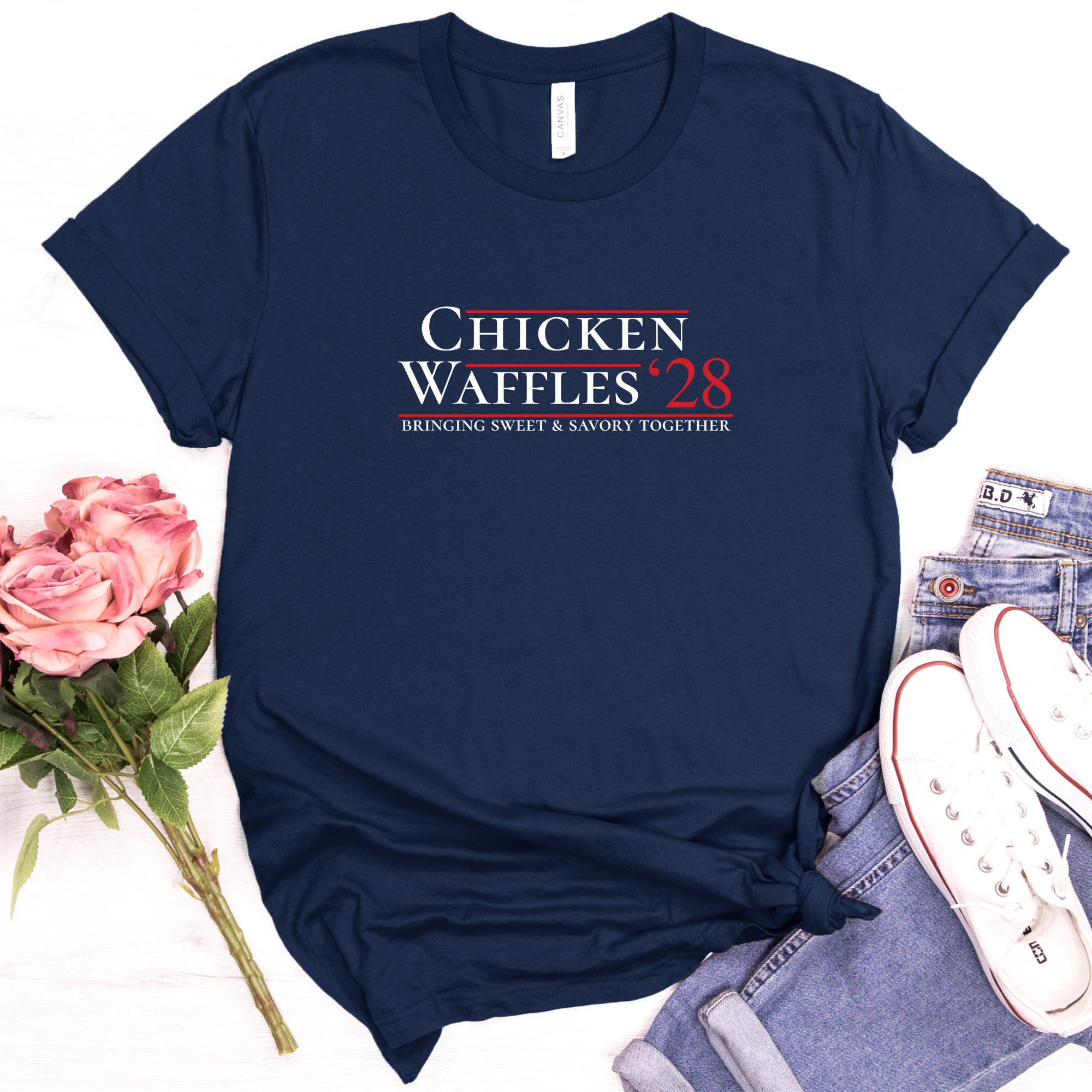 Navy Chicken Waffles ’28 campaign parody tee styled with jeans, flowers, and accessories
