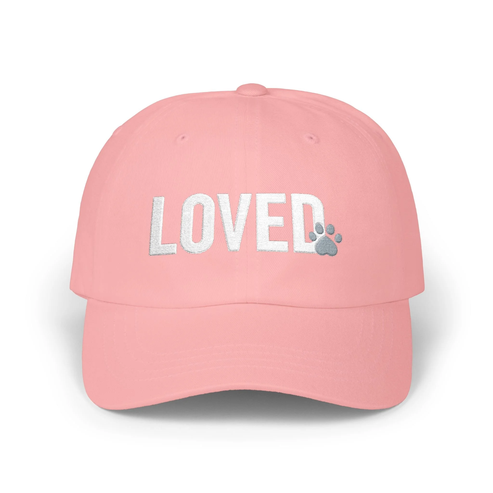 Front view of pink dad cap with white embroidered LOVED text