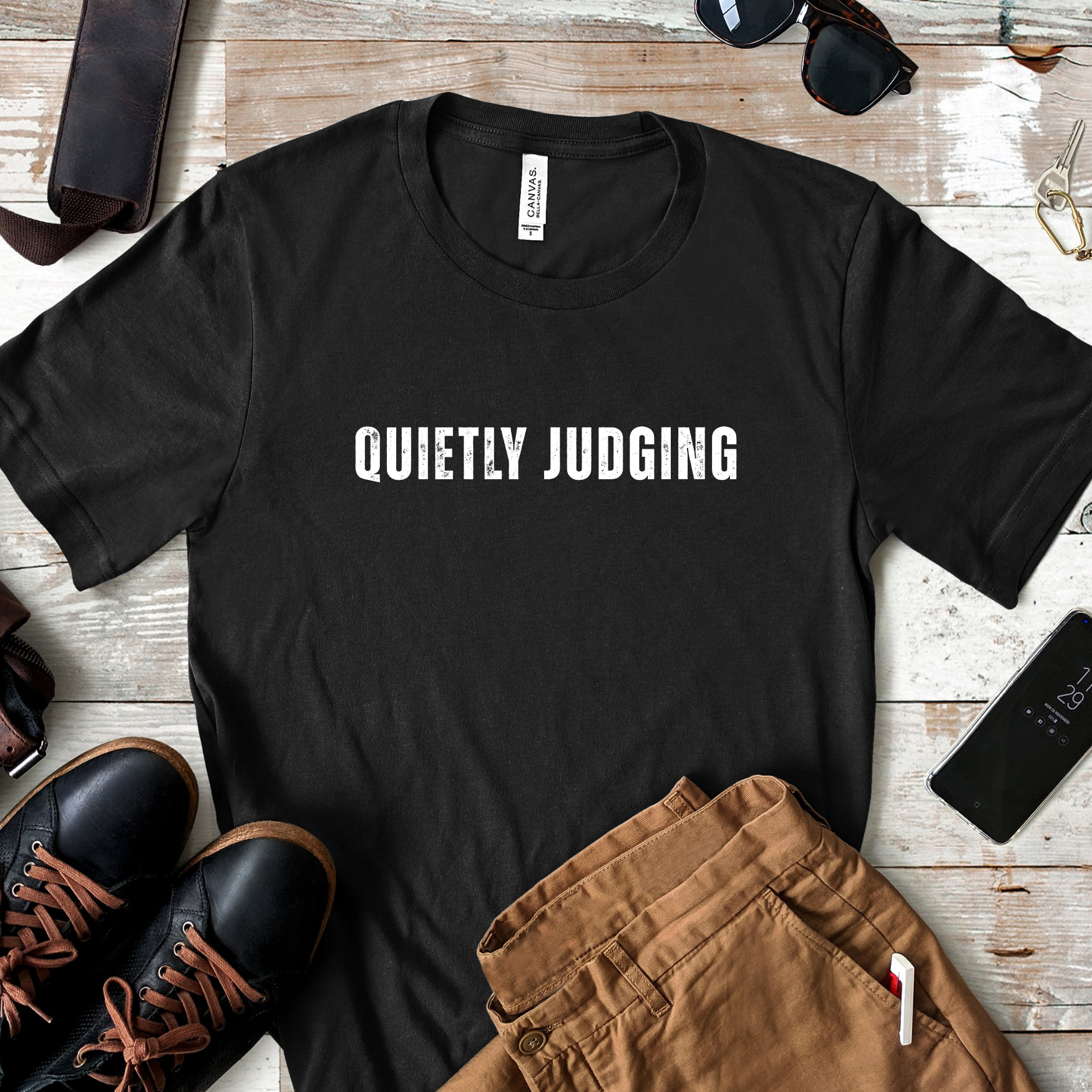 Lifestyle image of quietly judging t shirt styled with casual outfit