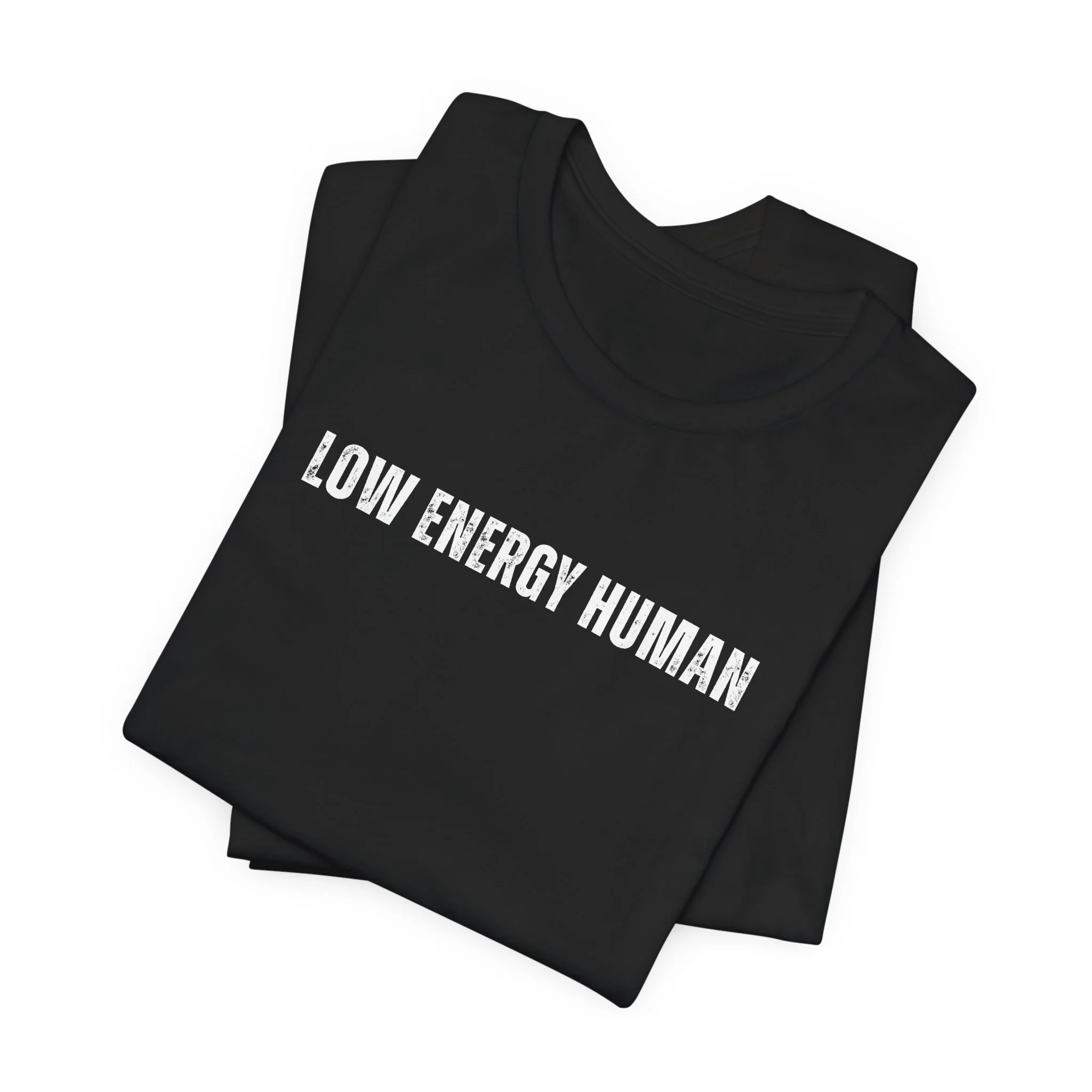 Folded black t shirt showing low energy human minimalist design