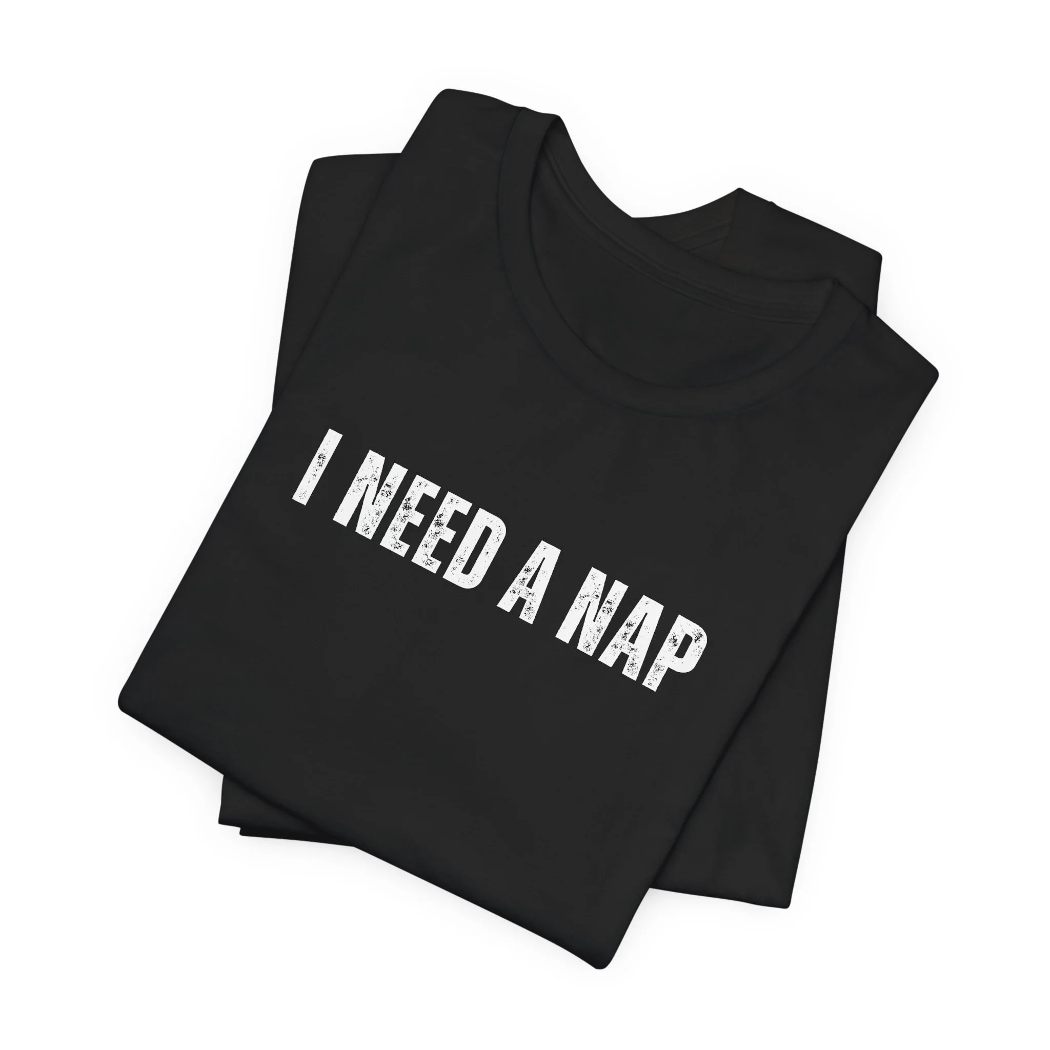 Folded black t shirt showing i need a nap minimalist lettering