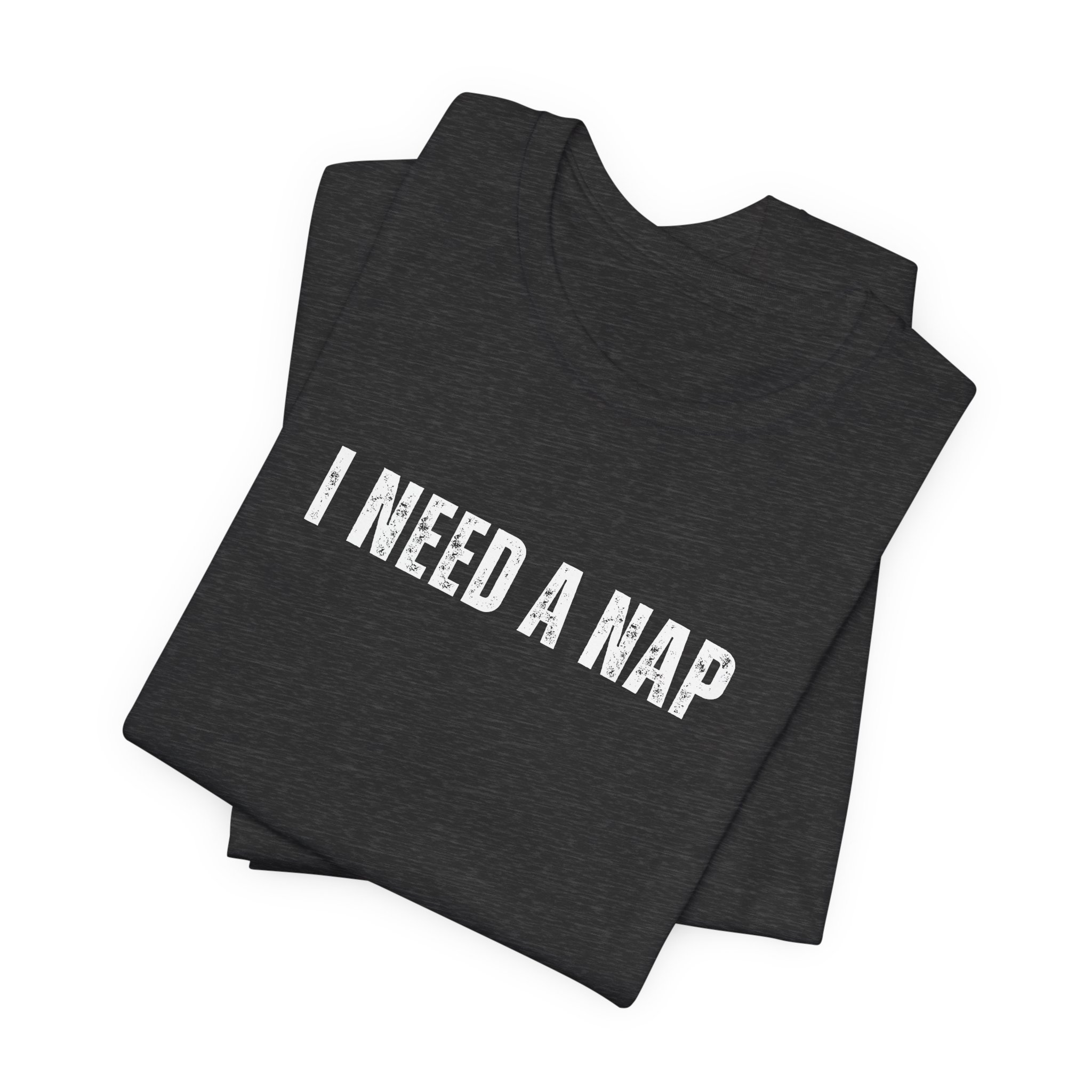 Folded dark heather gray t shirt with i need a nap white text