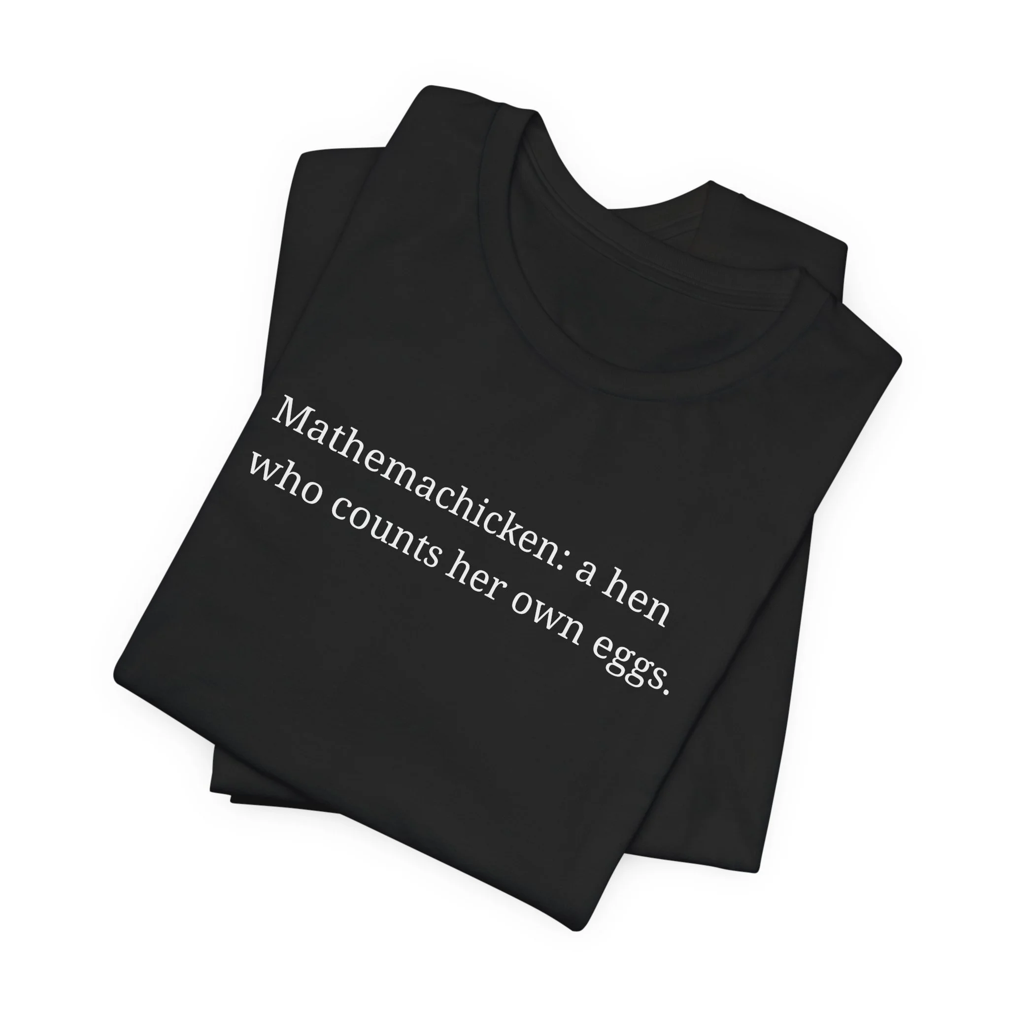Black t-shirt with minimalist white text reading “Mathemachicken: a hen who counts her own eggs,” folded to show the front design