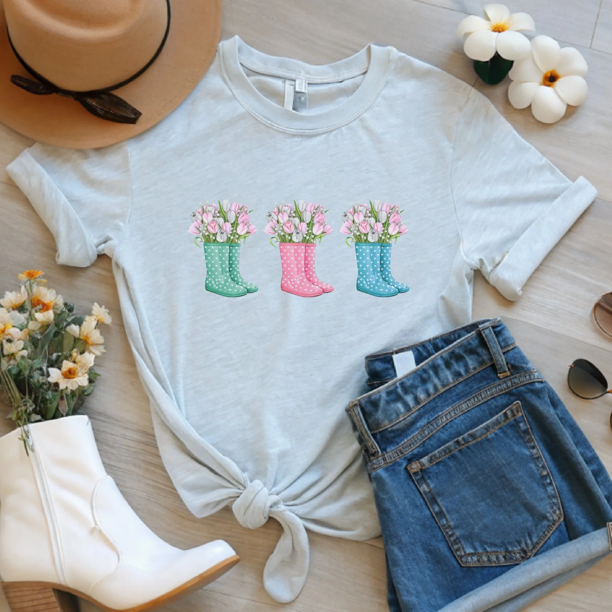 Daytime styled view of Floral Rain Boots graphic shirt on ash gray tee with jeans, sneakers, and spring accessories