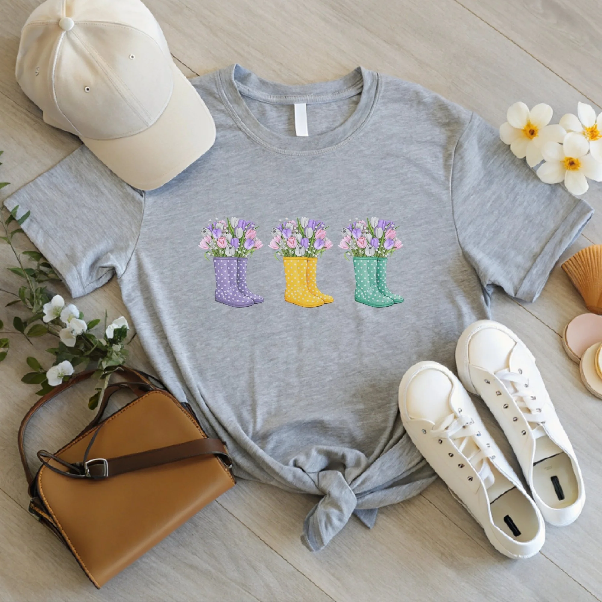 Daytime styled view of Floral Rain Boots graphic shirt on an athletic heather gray tee with jeans, sneakers, and spring accessories
