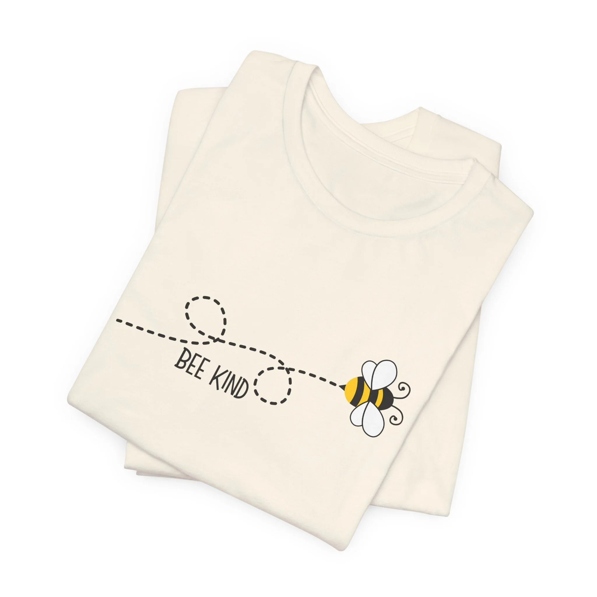Folded natural cream t-shirt featuring Bee Kind graphic