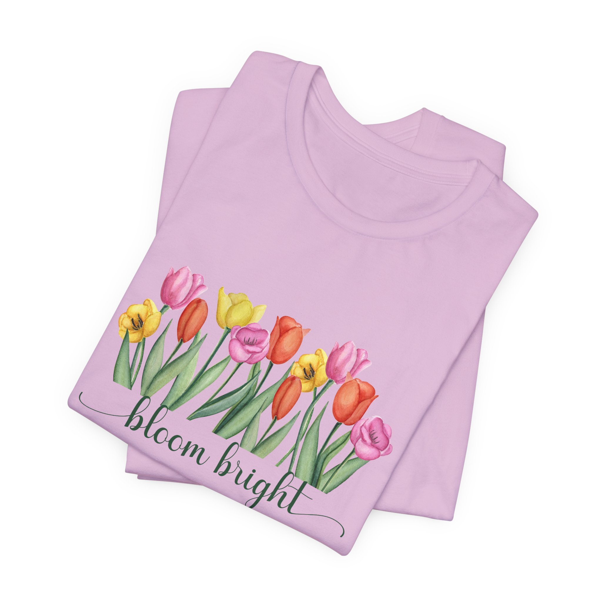 Folded lilac purple t-shirt featuring Bloom Bright graphic