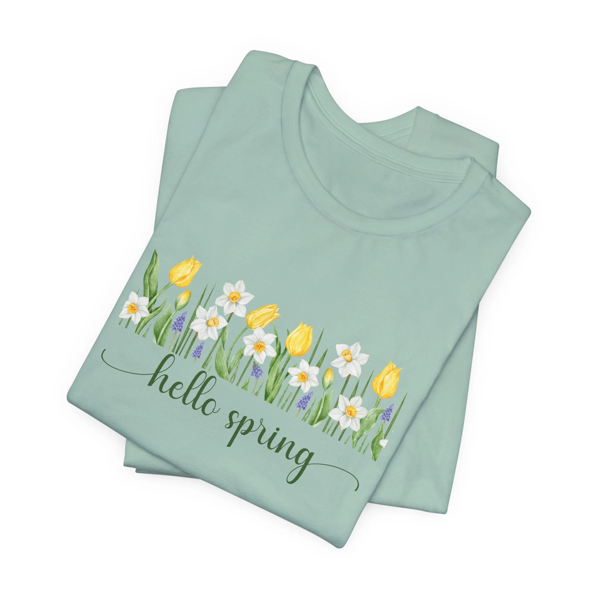 Folded dusty blue t-shirt featuring Hello Spring graphic